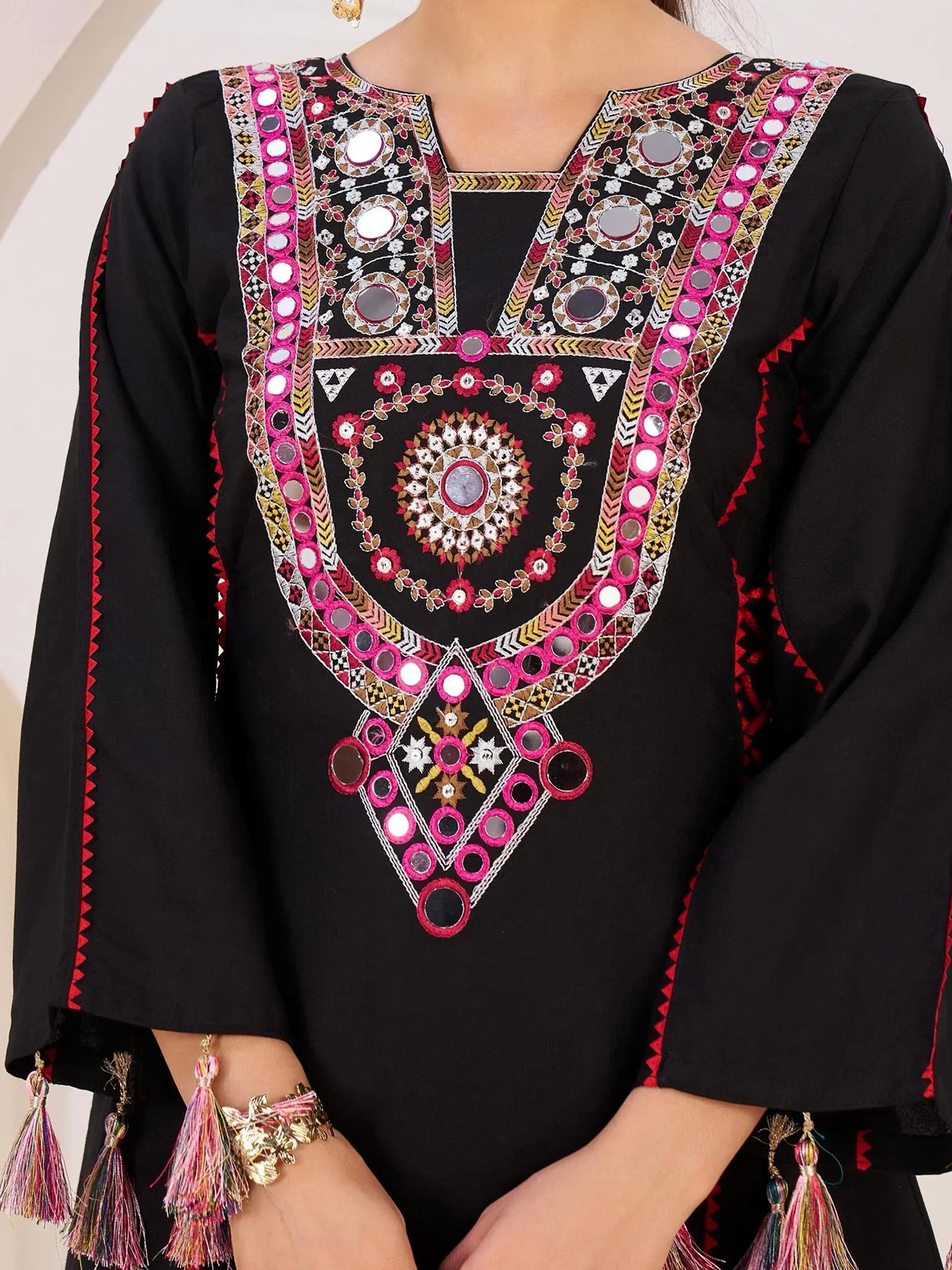 Black ethnic kurti with mirror work, floral embroidery, and tassel sleeves for Indian wear