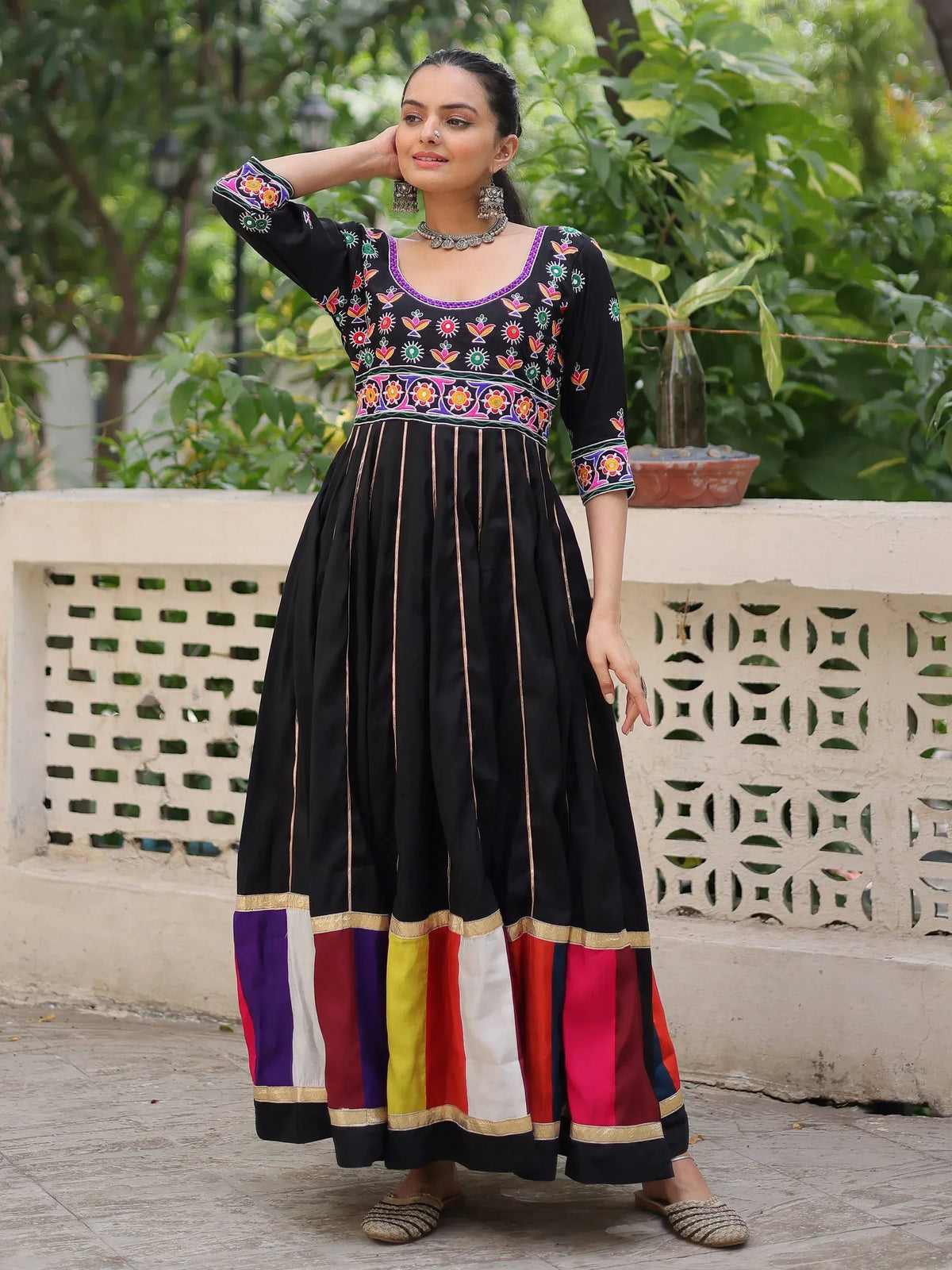 Black embroidered ethnic gown with colorful patchwork hem, perfect for Indian festive wear
