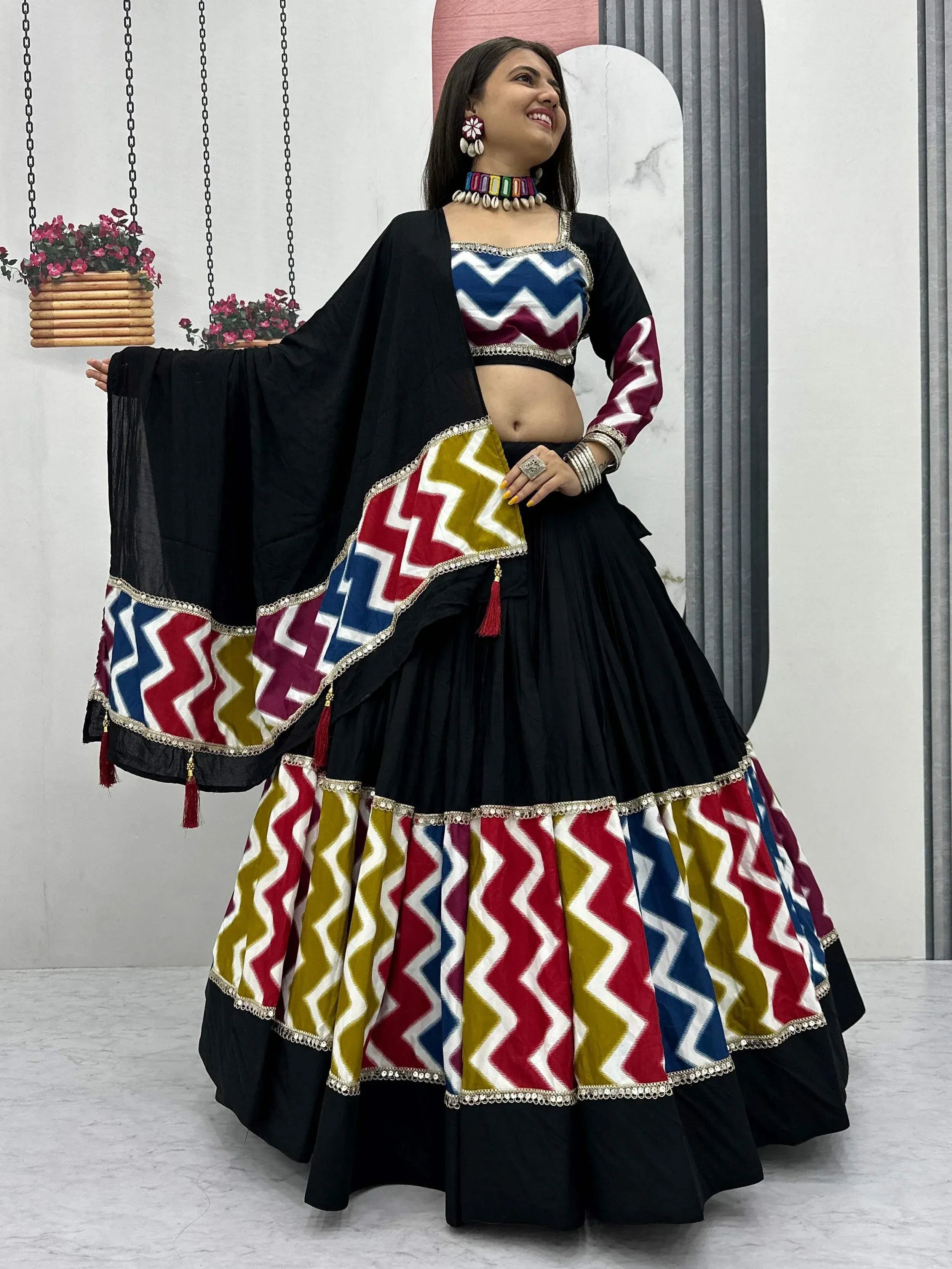 Black lehenga choli with colorful zigzag print, perfect for Indian ethnic wear and festive occasions.