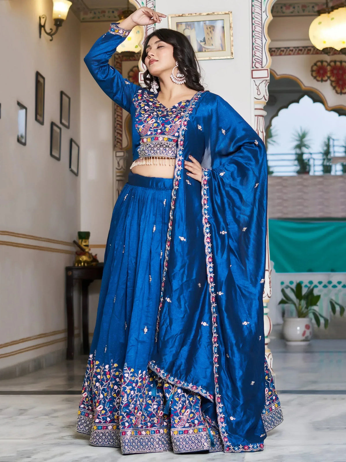Blue embroidered lehenga choli with floral motifs, perfect for Indian ethnic wear occasions