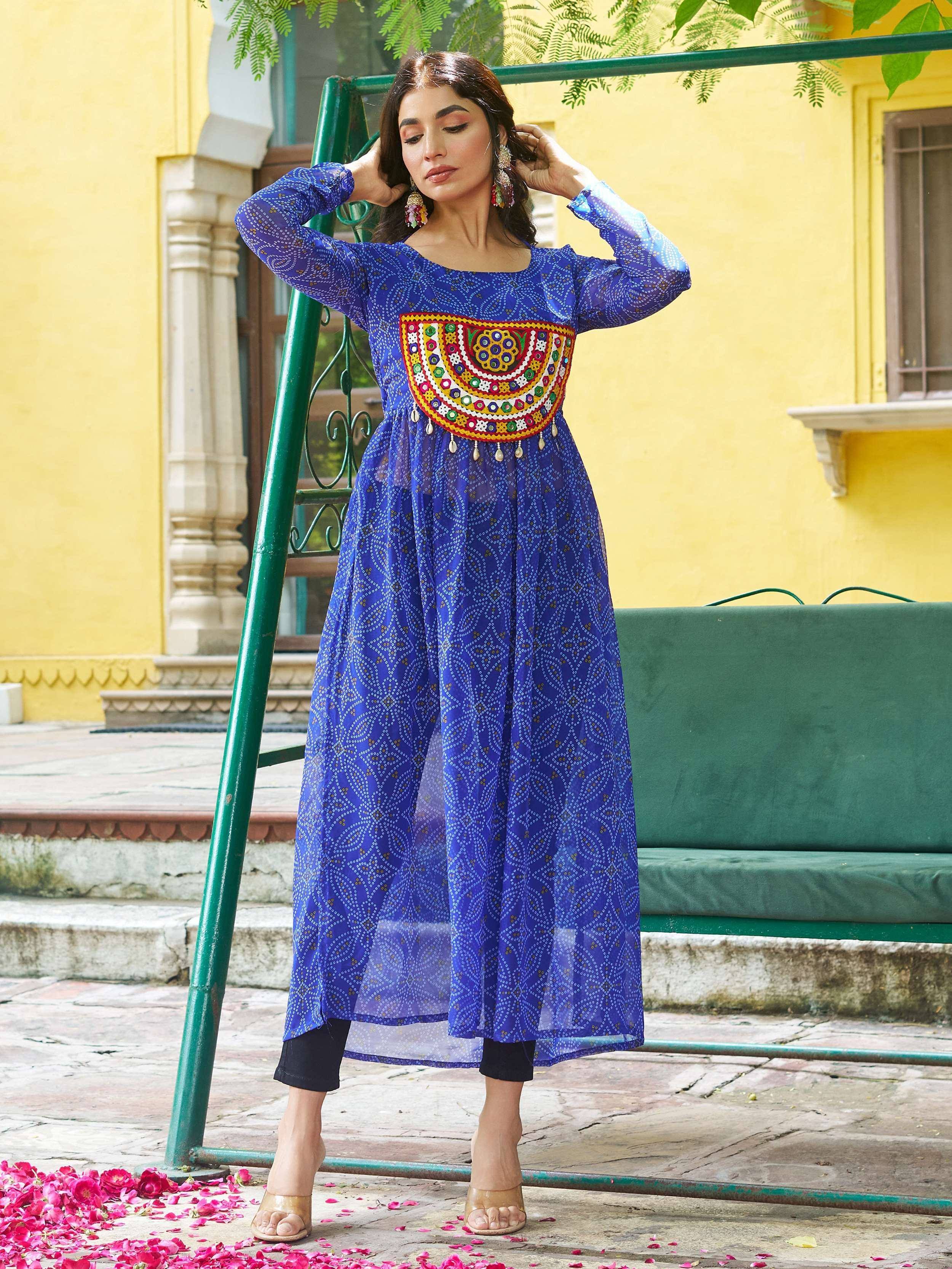 Blue ethnic gown with mirror work and printed pattern, styled with black pants and heels