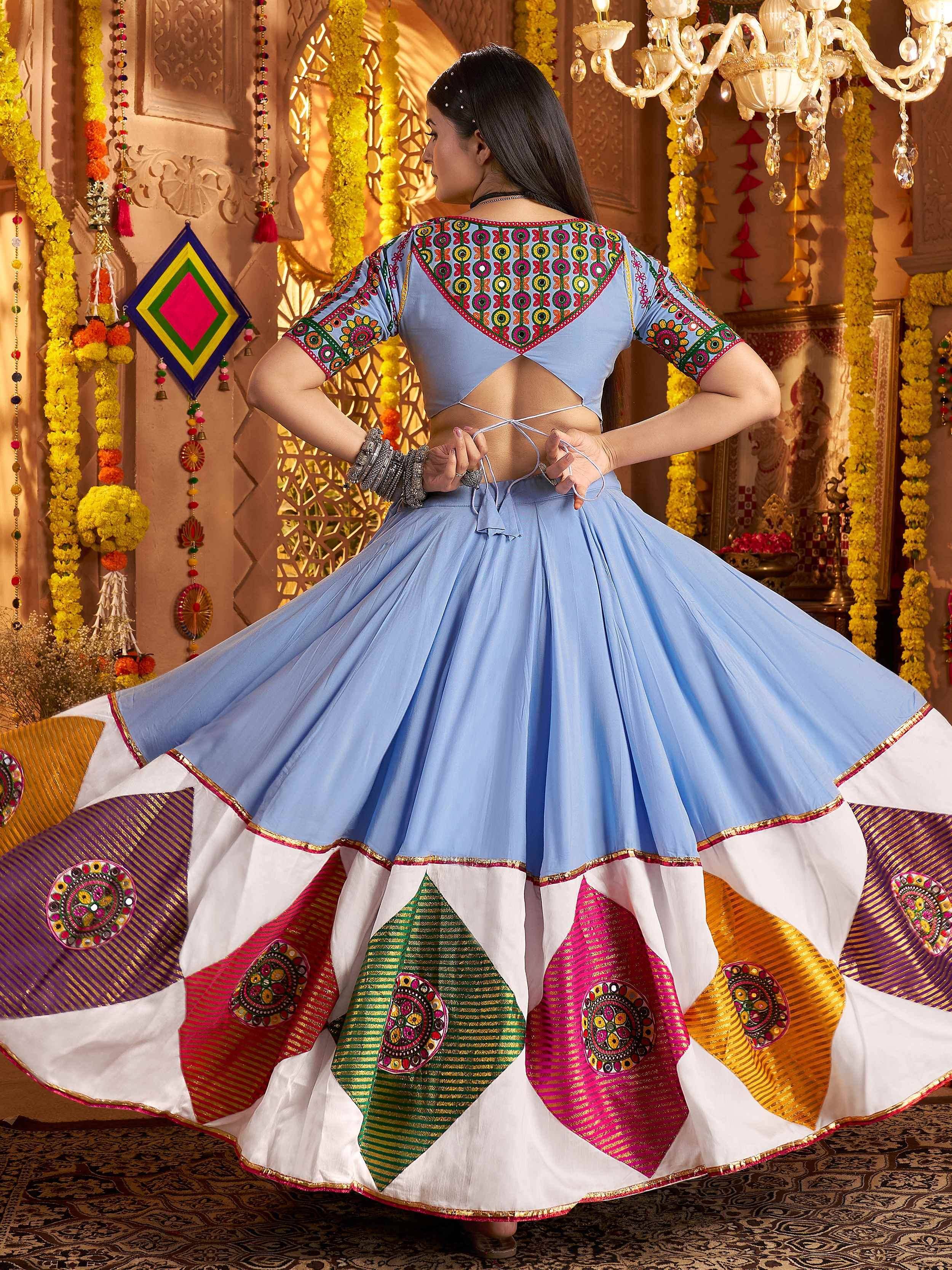 Blue embroidered lehenga choli with colorful patchwork skirt, perfect for Indian ethnic wear and festive occasions.