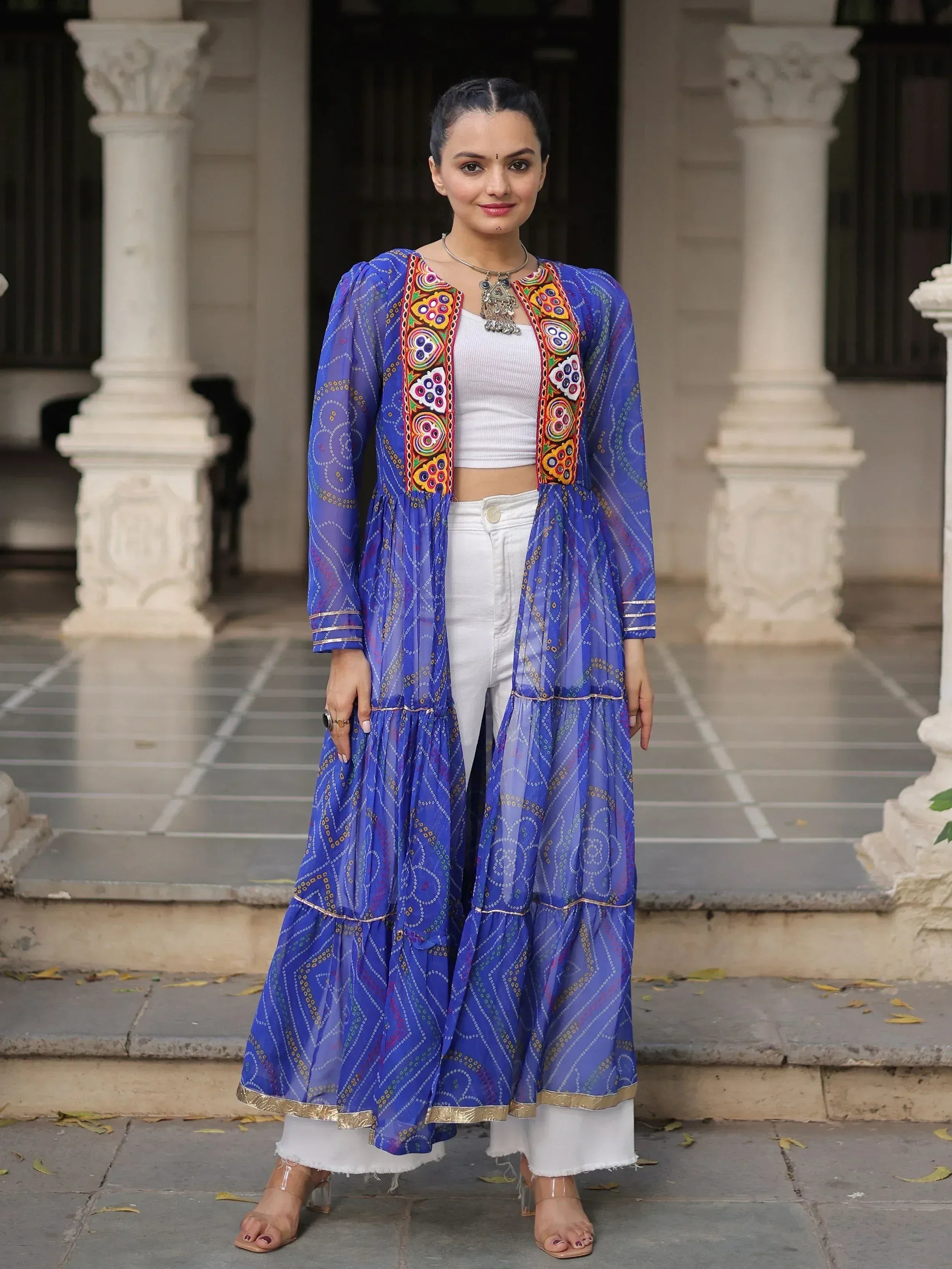 Blue embroidered ethnic jacket with white crop top and pants, perfect for Indian festive wear