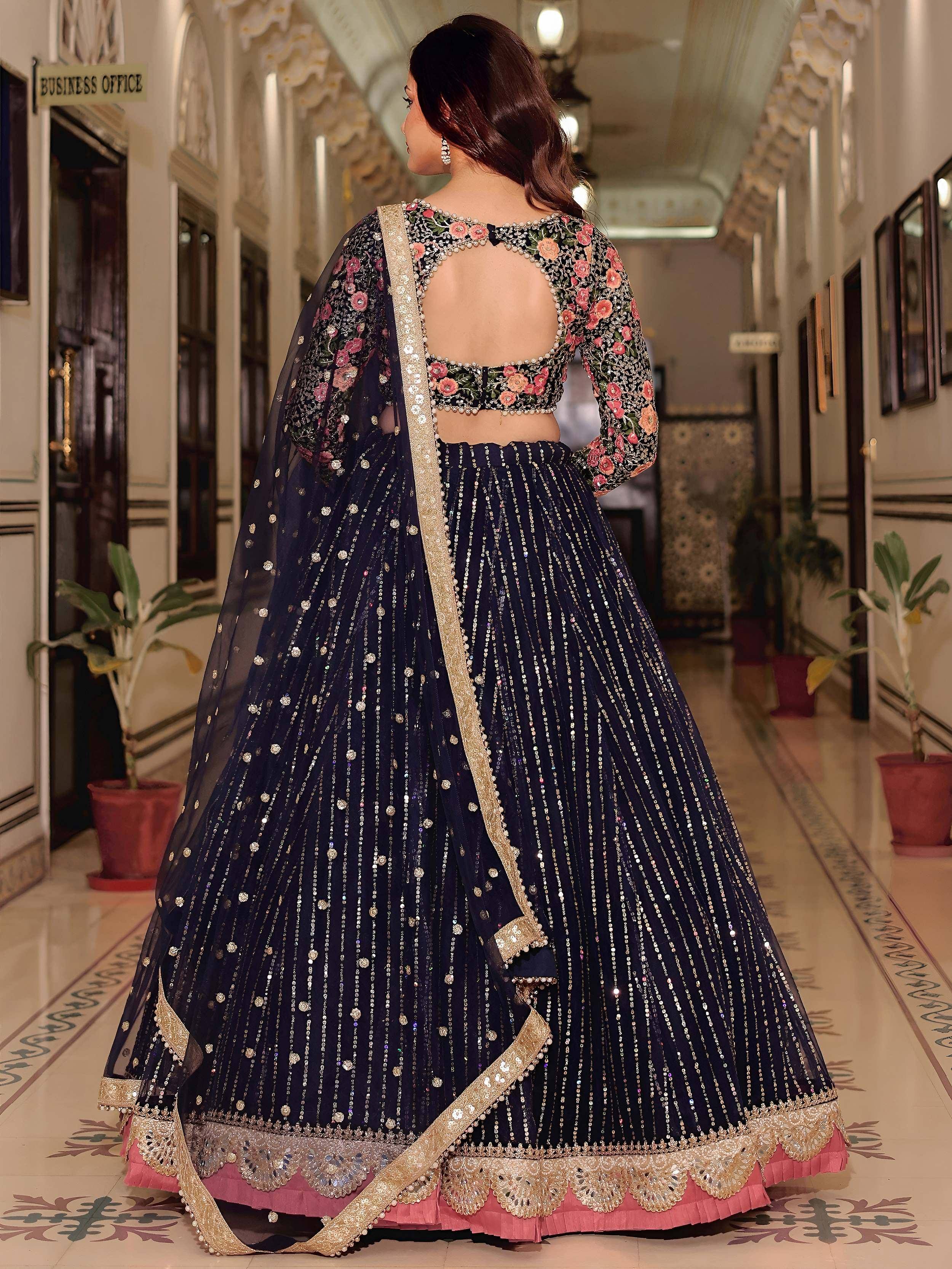 Navy blue floral embroidered lehenga choli with gold sequin detailing and open back design