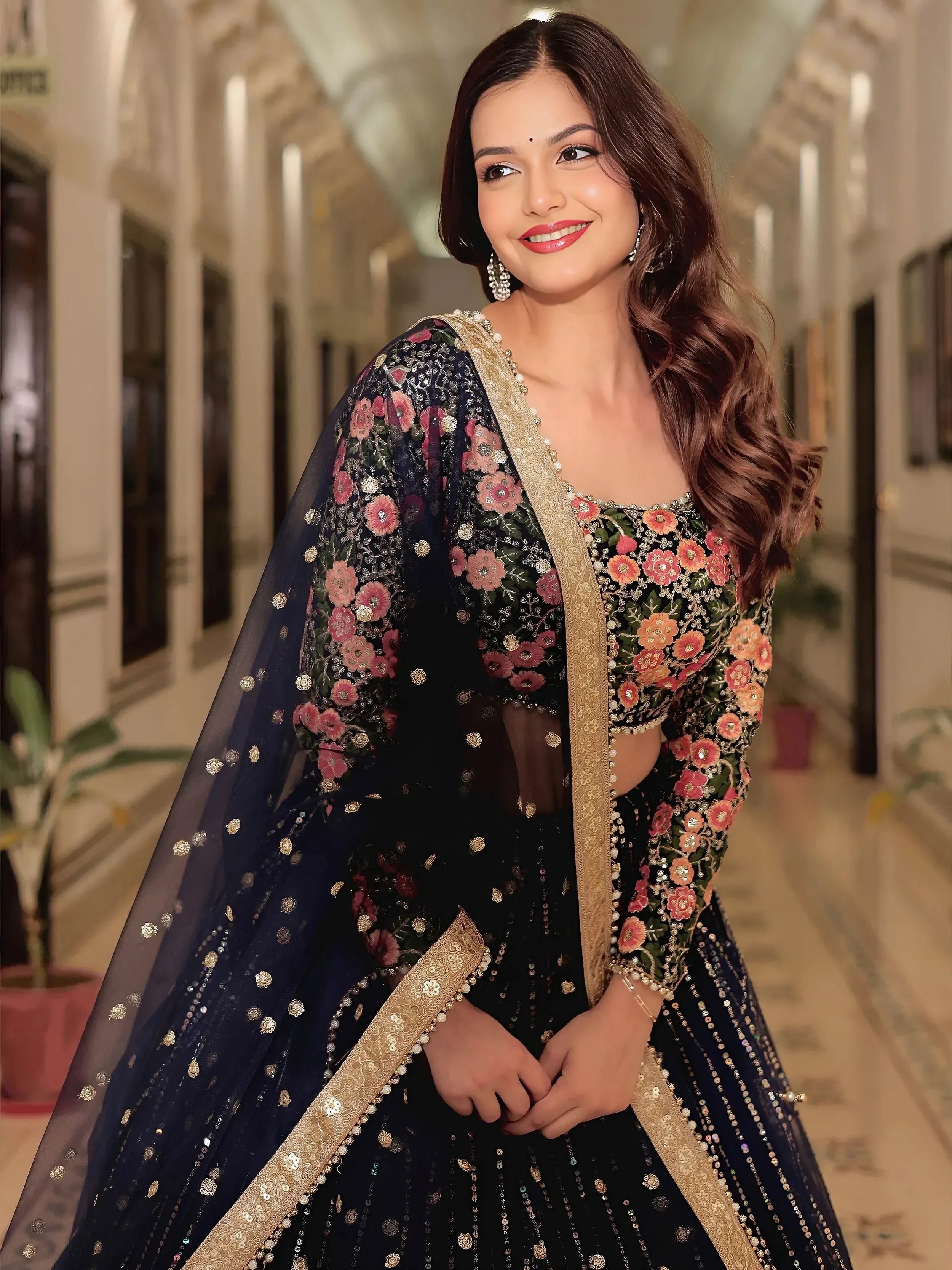 Elegant navy blue lehenga choli with floral embroidery and gold detailing, perfect for Indian ethnic wear.