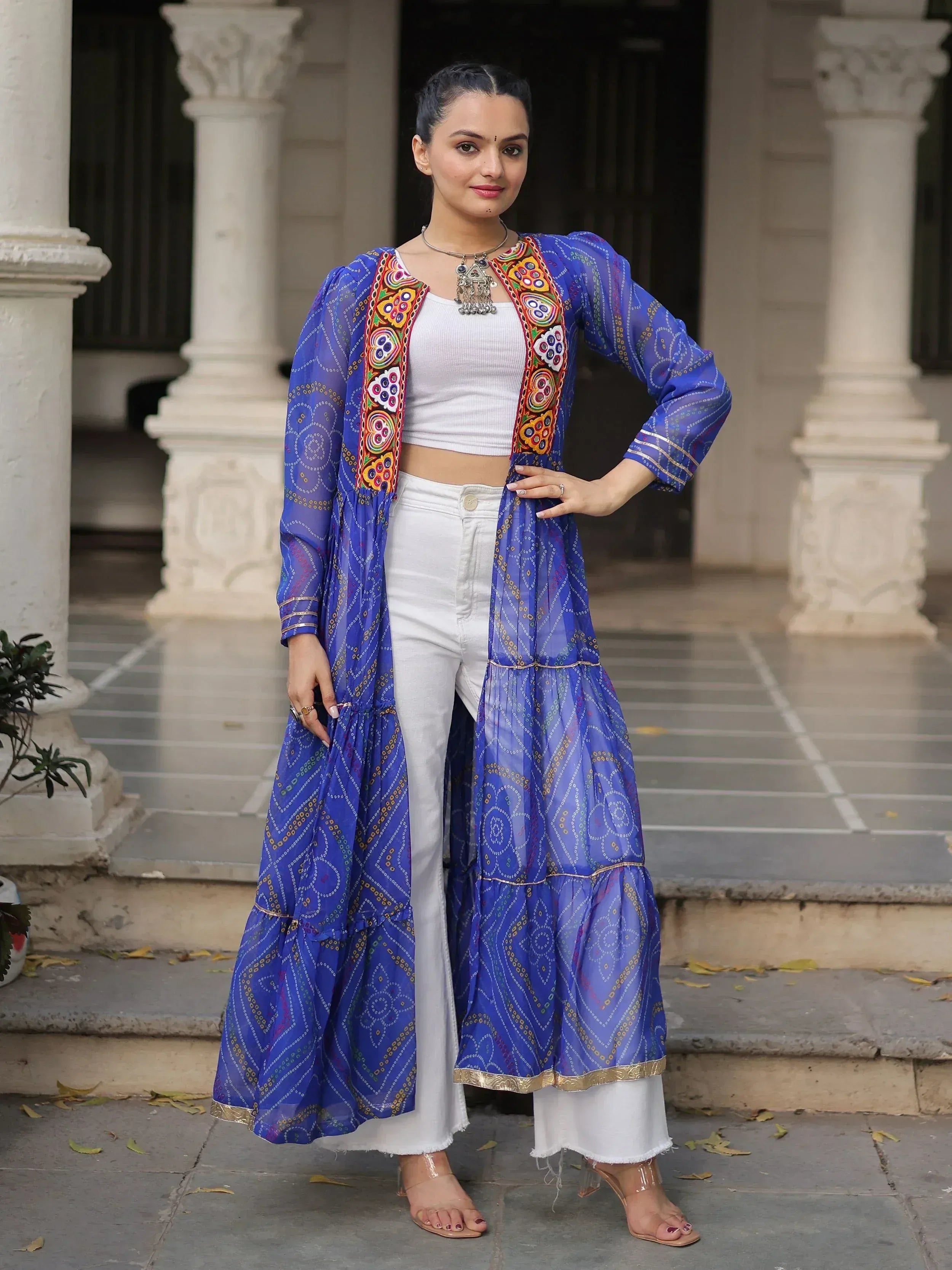 Blue embroidered ethnic jacket with white crop top and pants, styled for Indian wear