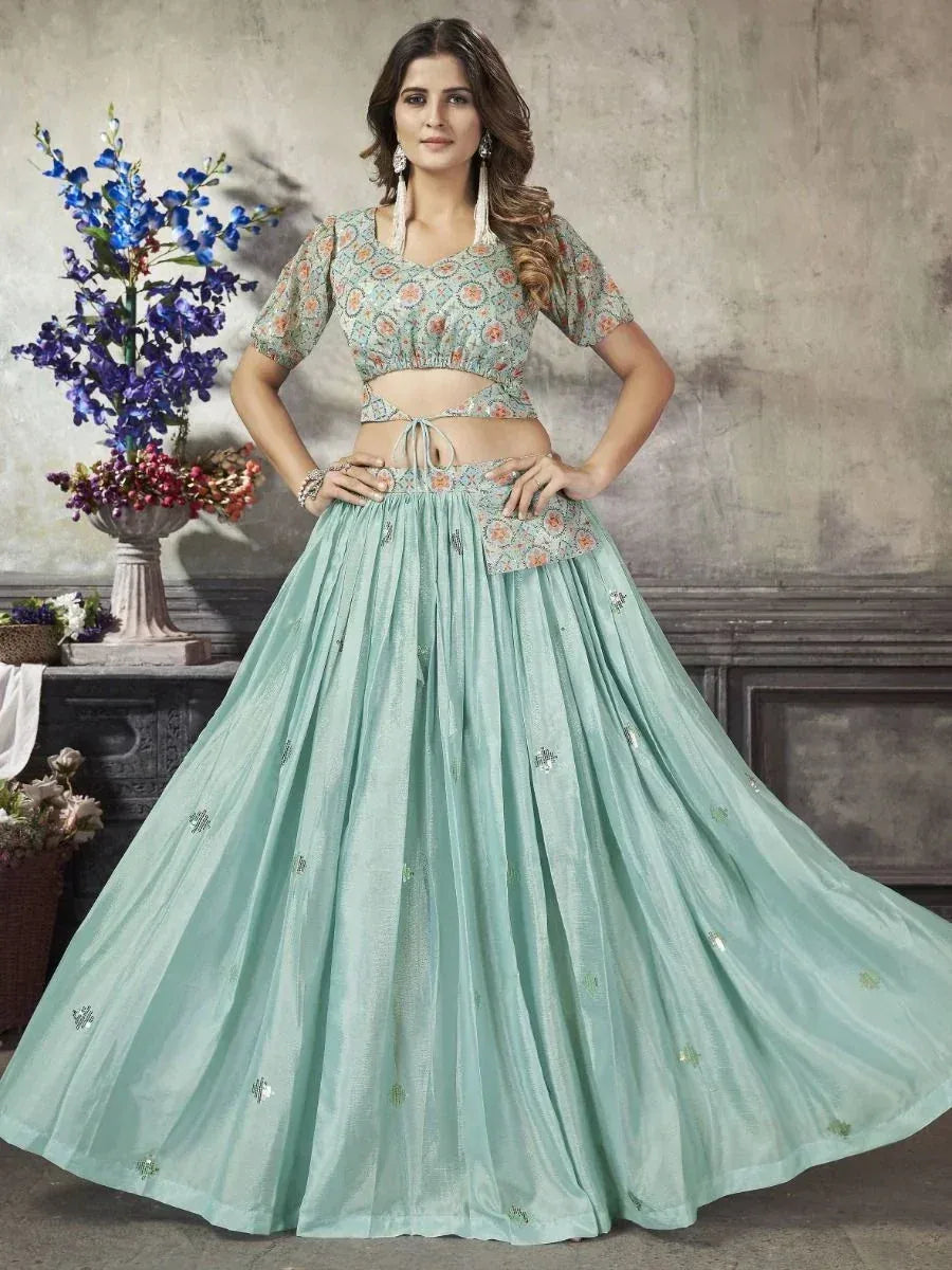 Mint green designer lehenga choli with floral print top and embellished skirt, perfect for Indian ethnic wear