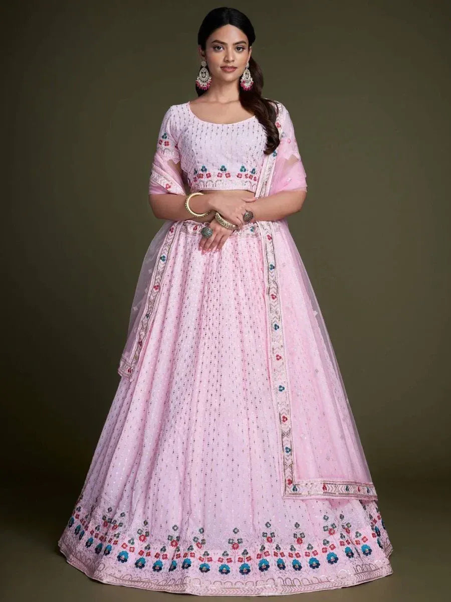 Pink embroidered lehenga choli with floral motifs, perfect for Indian ethnic occasions