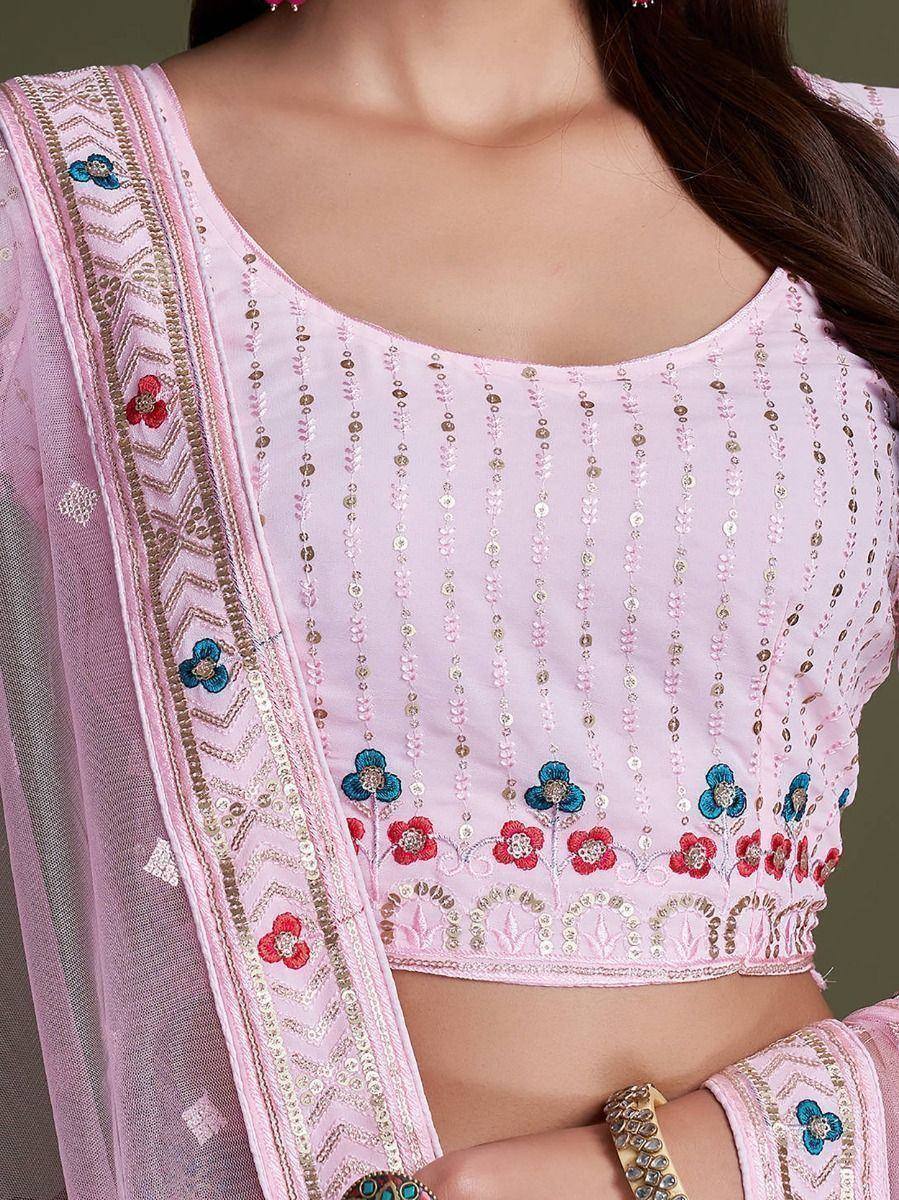 Pink embroidered lehenga choli with floral motifs and sequin detailing, perfect for Indian ethnic wear