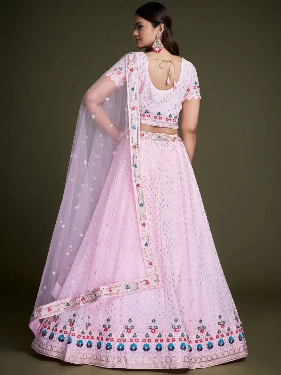 Pink embroidered lehenga choli with floral motifs and sheer dupatta, ideal for Indian ethnic occasions