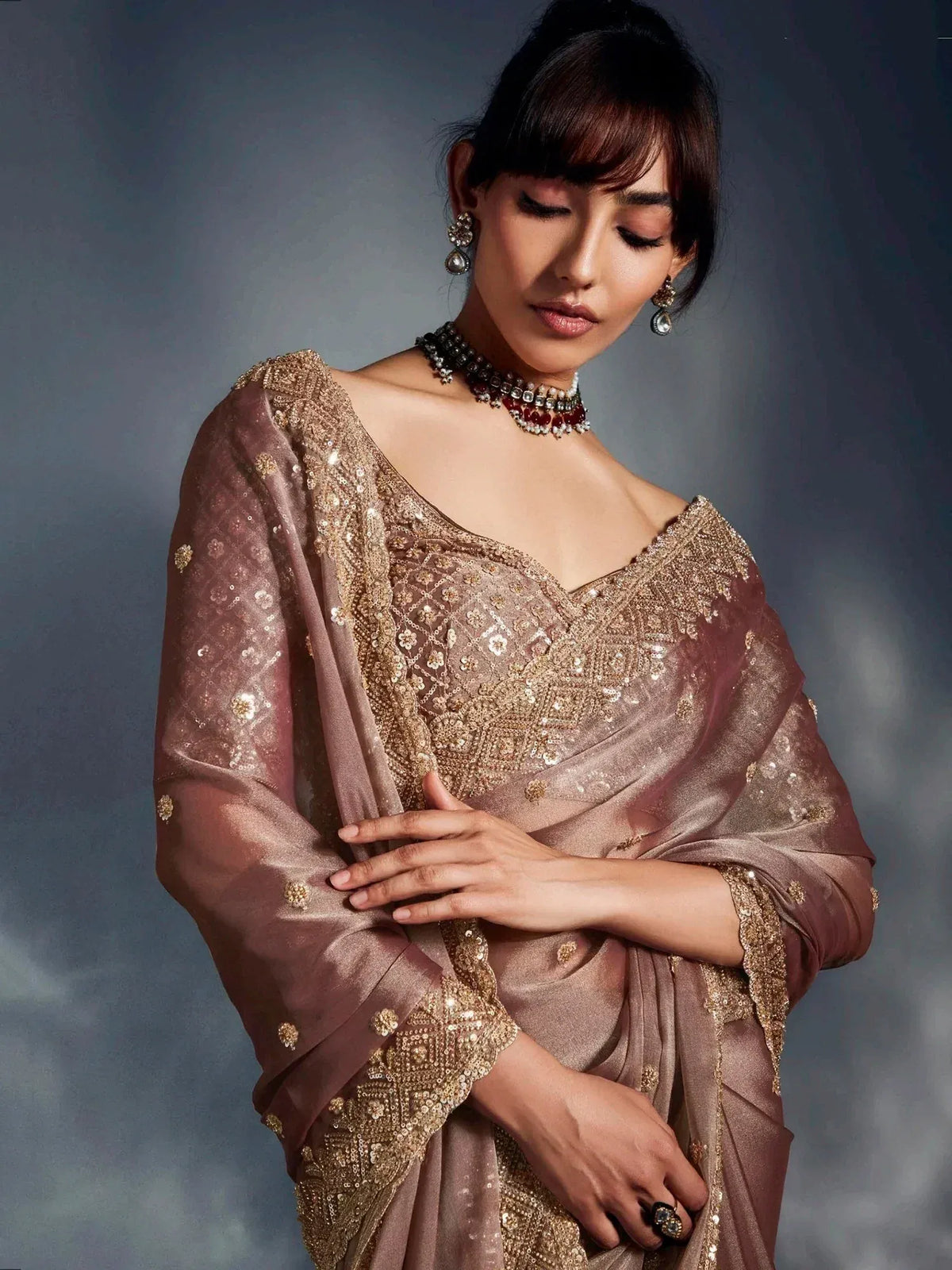 Elegant mauve saree with gold embroidery, perfect for Indian ethnic wear events
