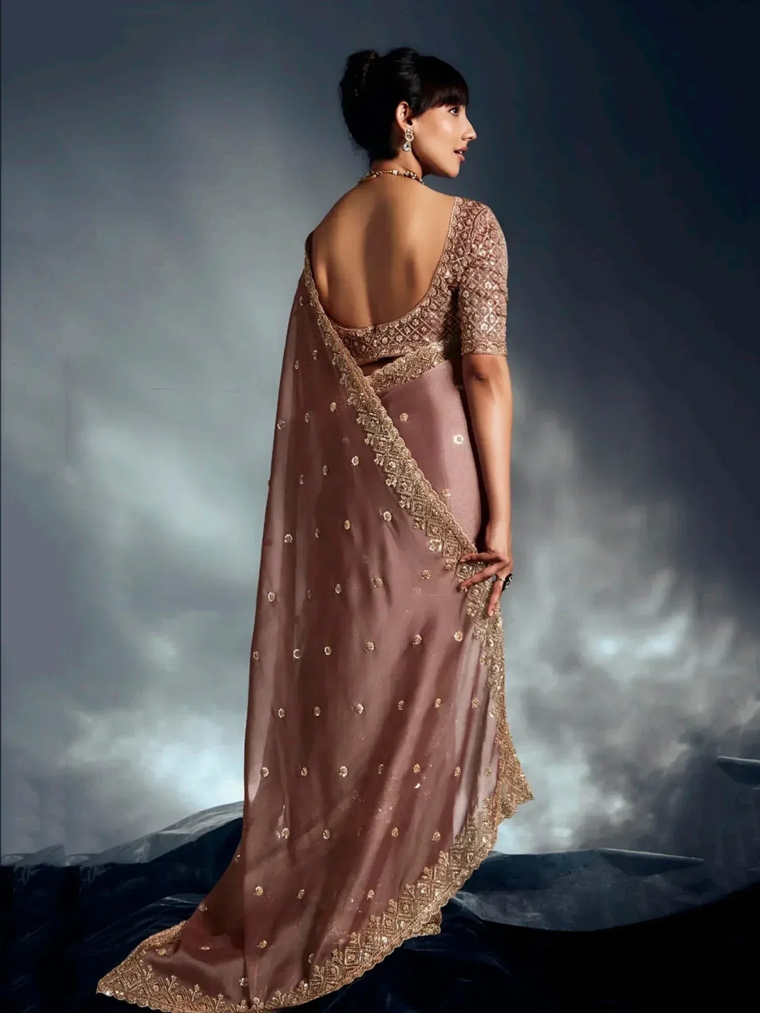 Elegant mauve saree with gold embroidery and backless blouse, perfect for Indian ethnic occasions