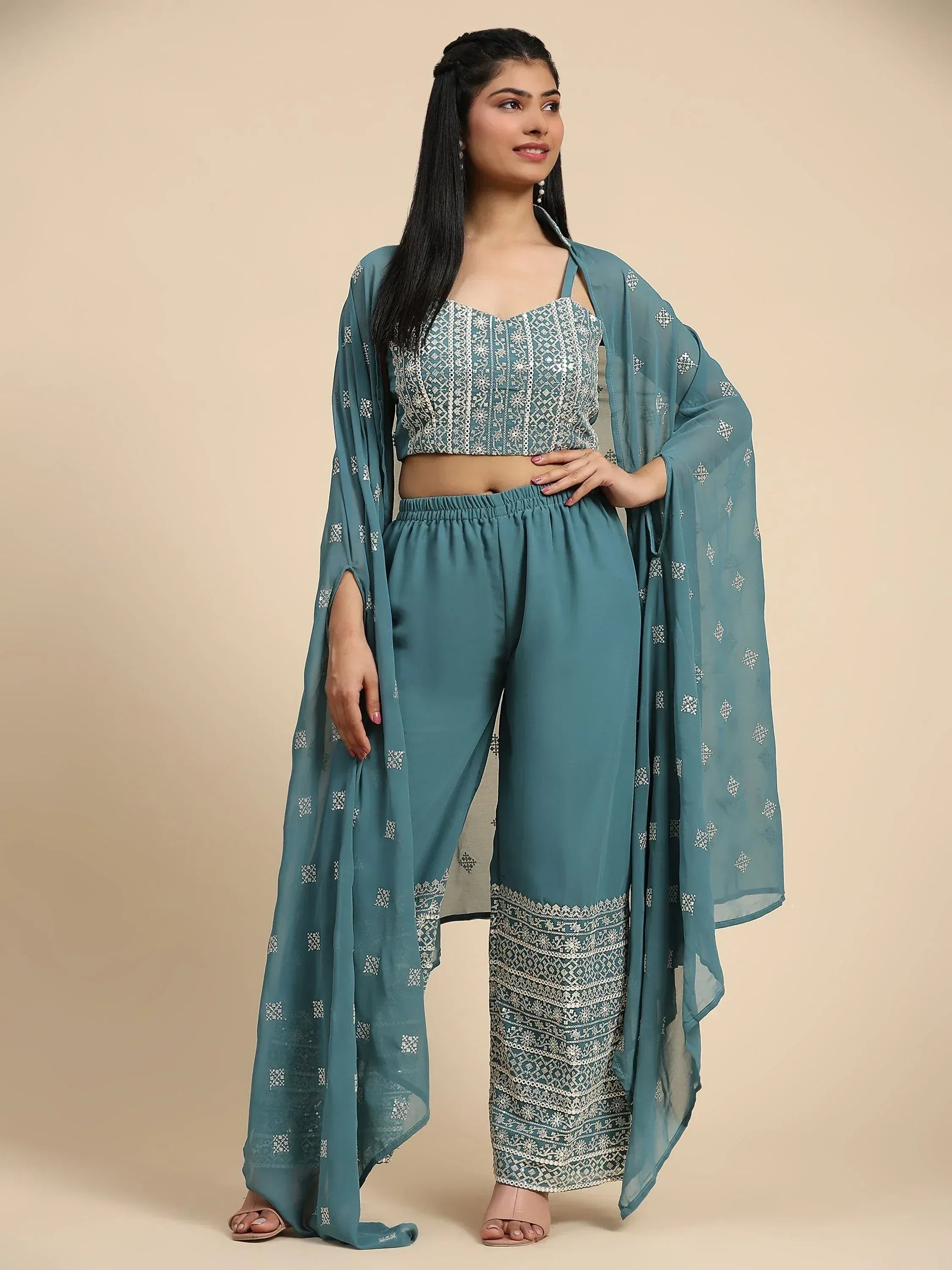 Woman wearing teal embroidered ethnic palazzo set with matching dupatta, Indian festive wear