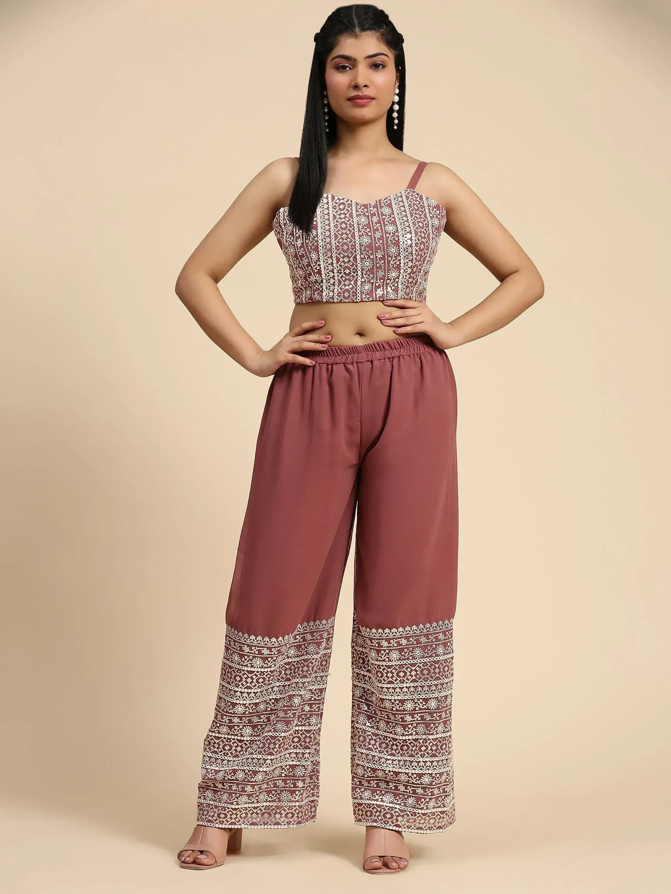 Woman wearing mauve ethnic crop top and palazzo pants with white embroidered patterns