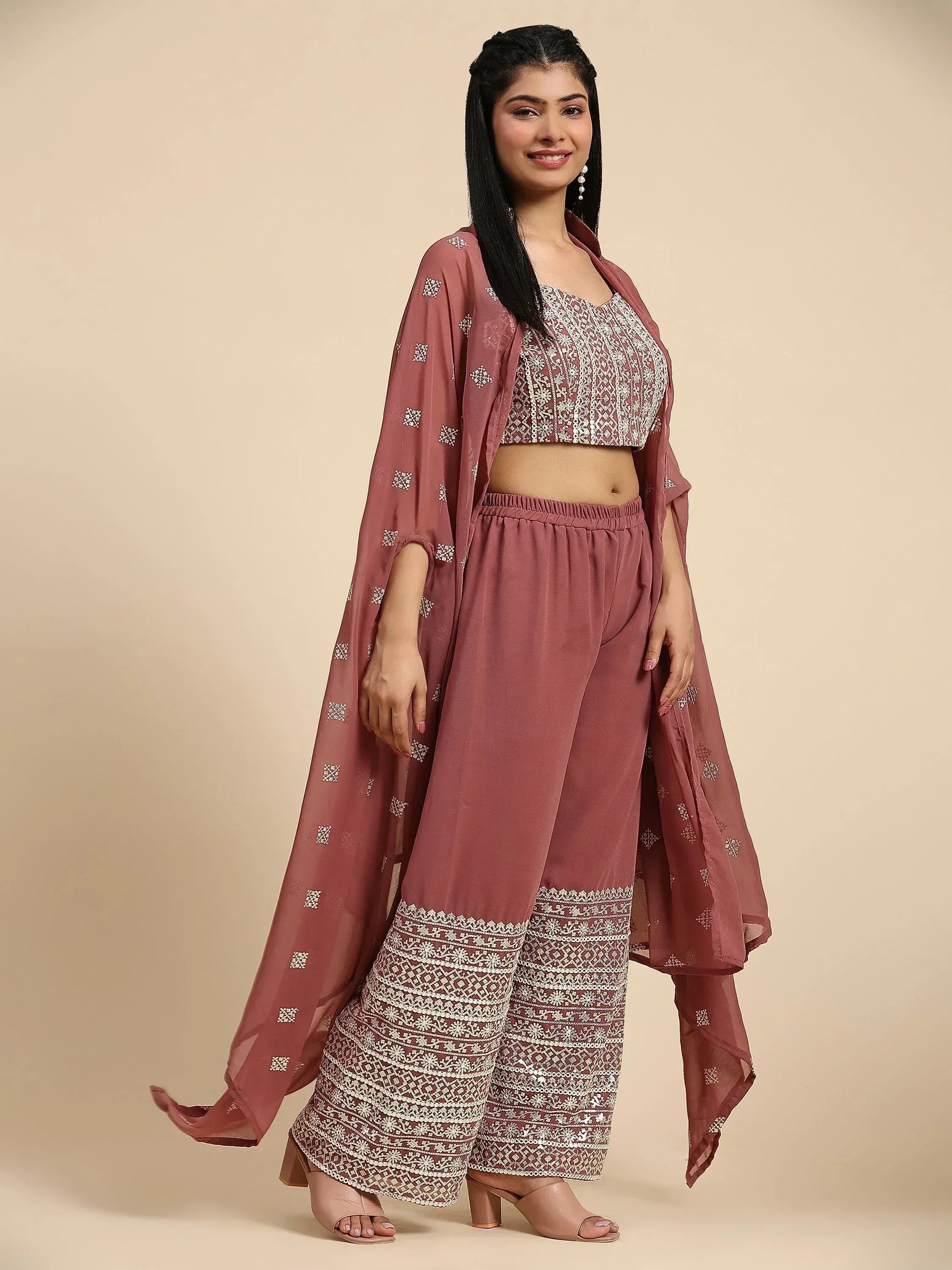 Woman in mauve embroidered ethnic crop top, palazzo pants, and long shrug set