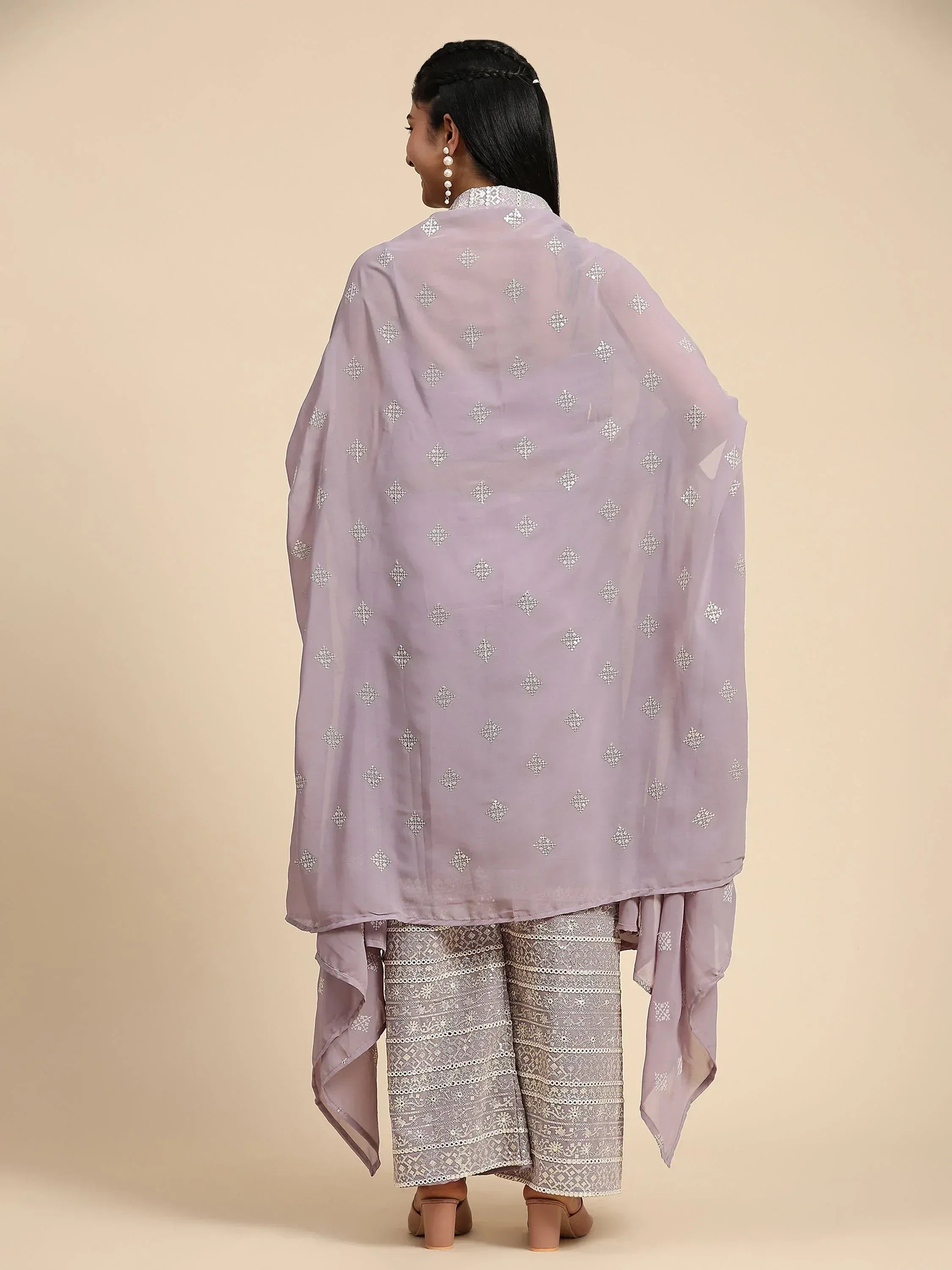 Woman in lavender embroidered palazzo suit with dupatta, back view, ethnic Indian wear