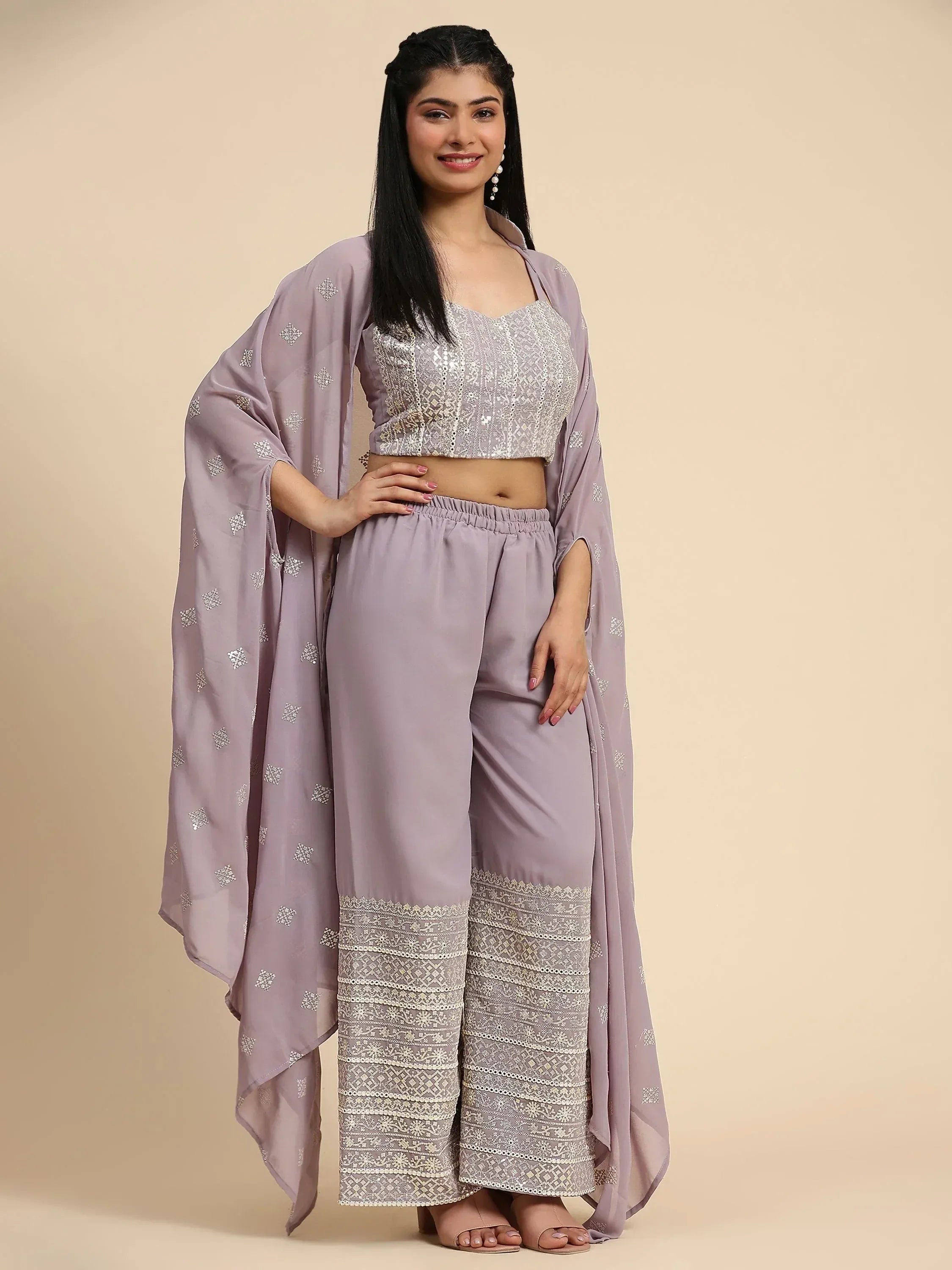 Woman wearing lavender embroidered ethnic crop top, palazzo pants, and matching dupatta