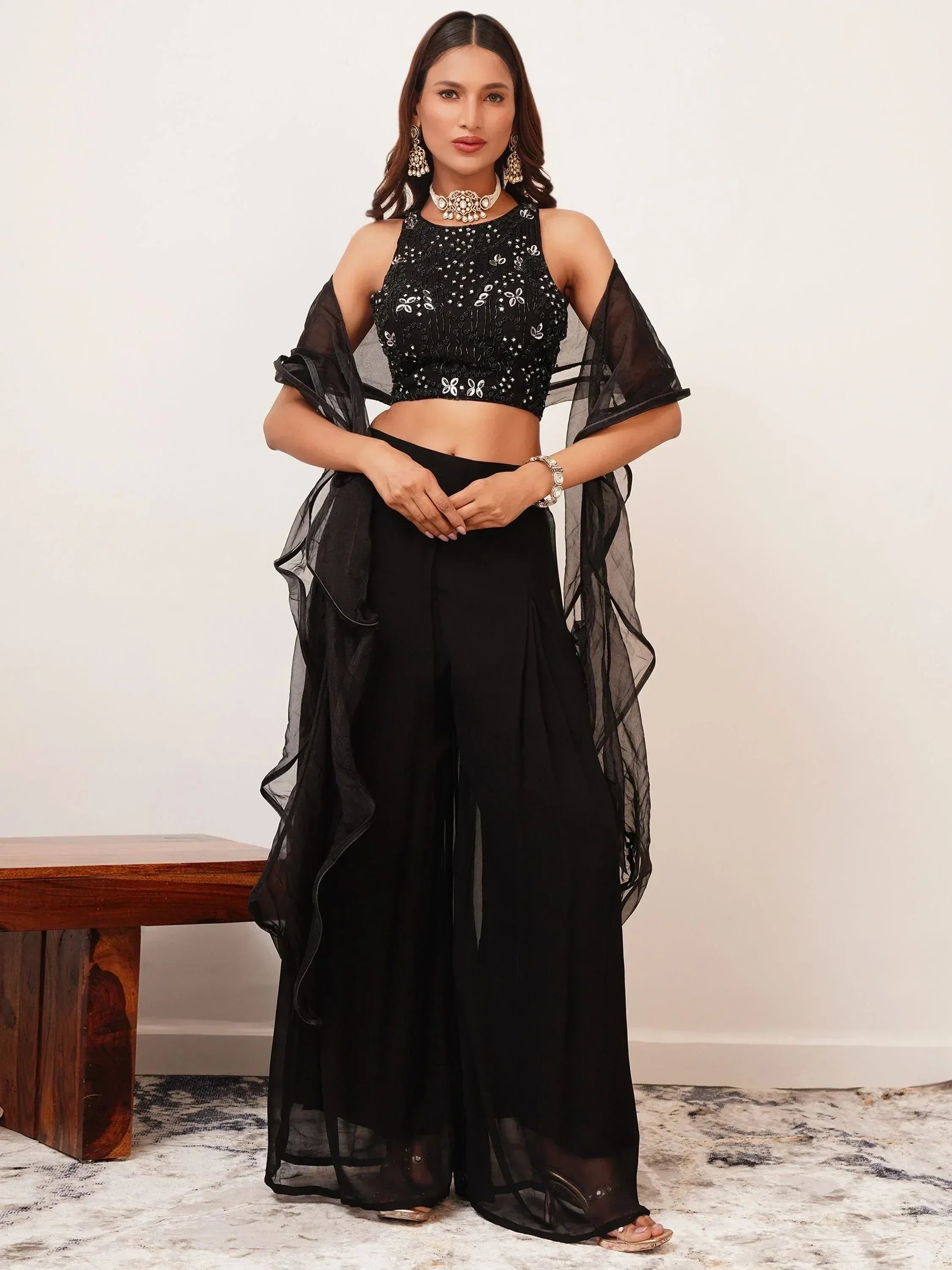 Woman in black sequin ethnic crop top with palazzo pants and dupatta, Indian party wear