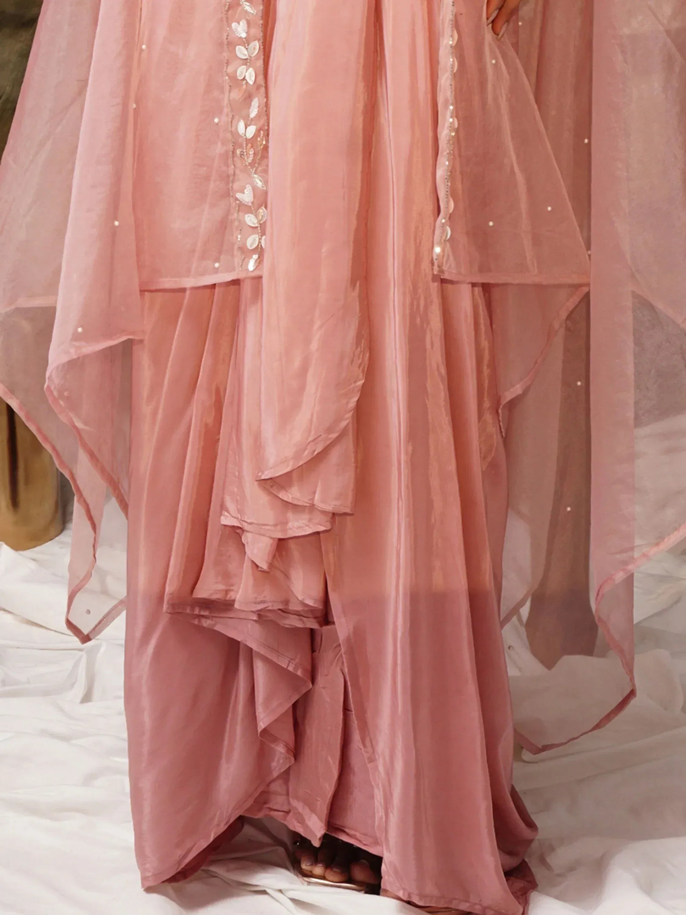 Pink ethnic gown with layered ruffles and leaf embroidery, perfect for Indian occasions