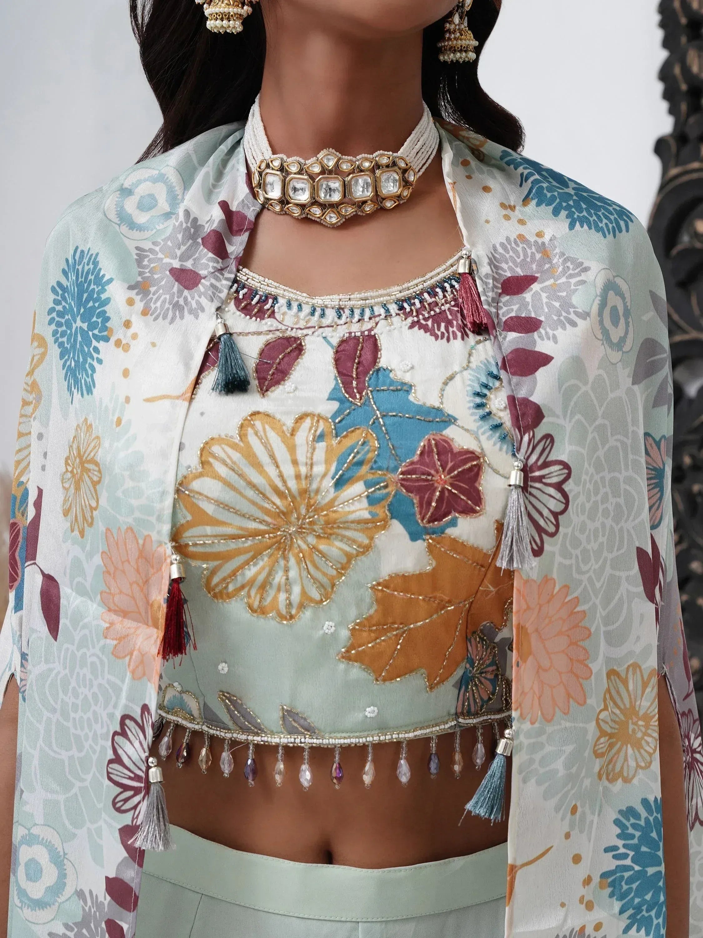 Floral embroidered lehenga choli with pastel dupatta and traditional jewelry
