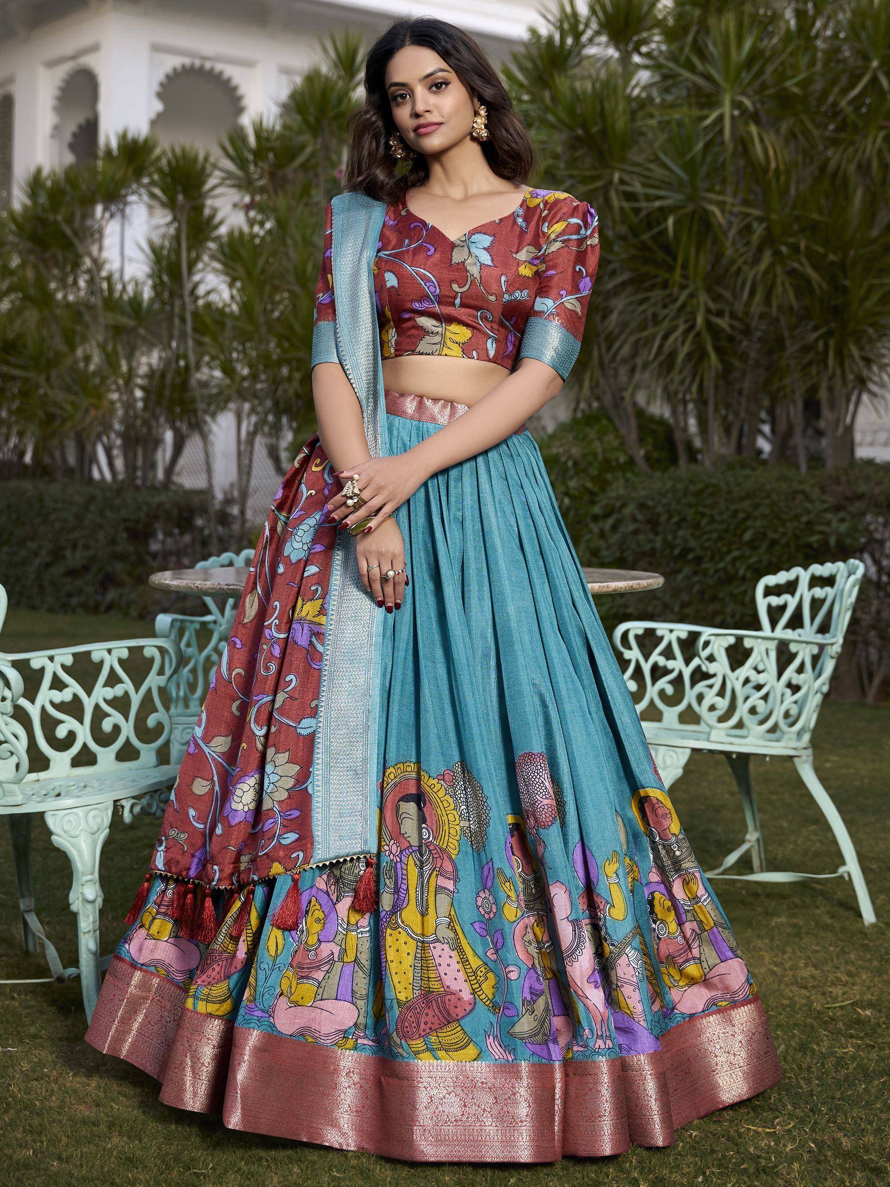 Woman in colorful printed lehenga choli with ethnic artwork, perfect for Indian festive occasions