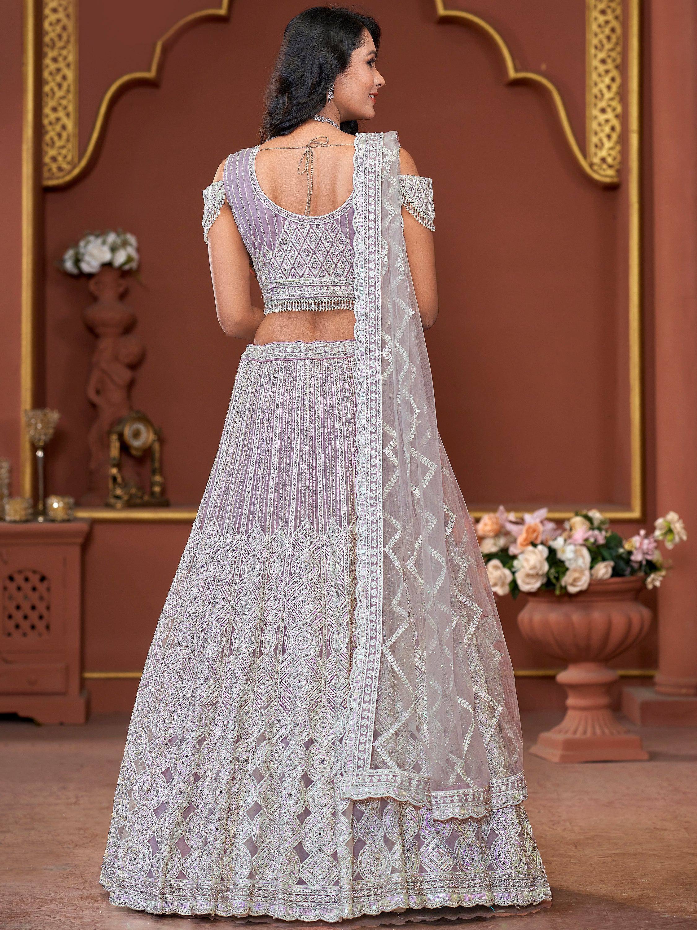 Elegant lavender lehenga choli with intricate embroidery and sheer dupatta, perfect for Indian weddings and festivals.