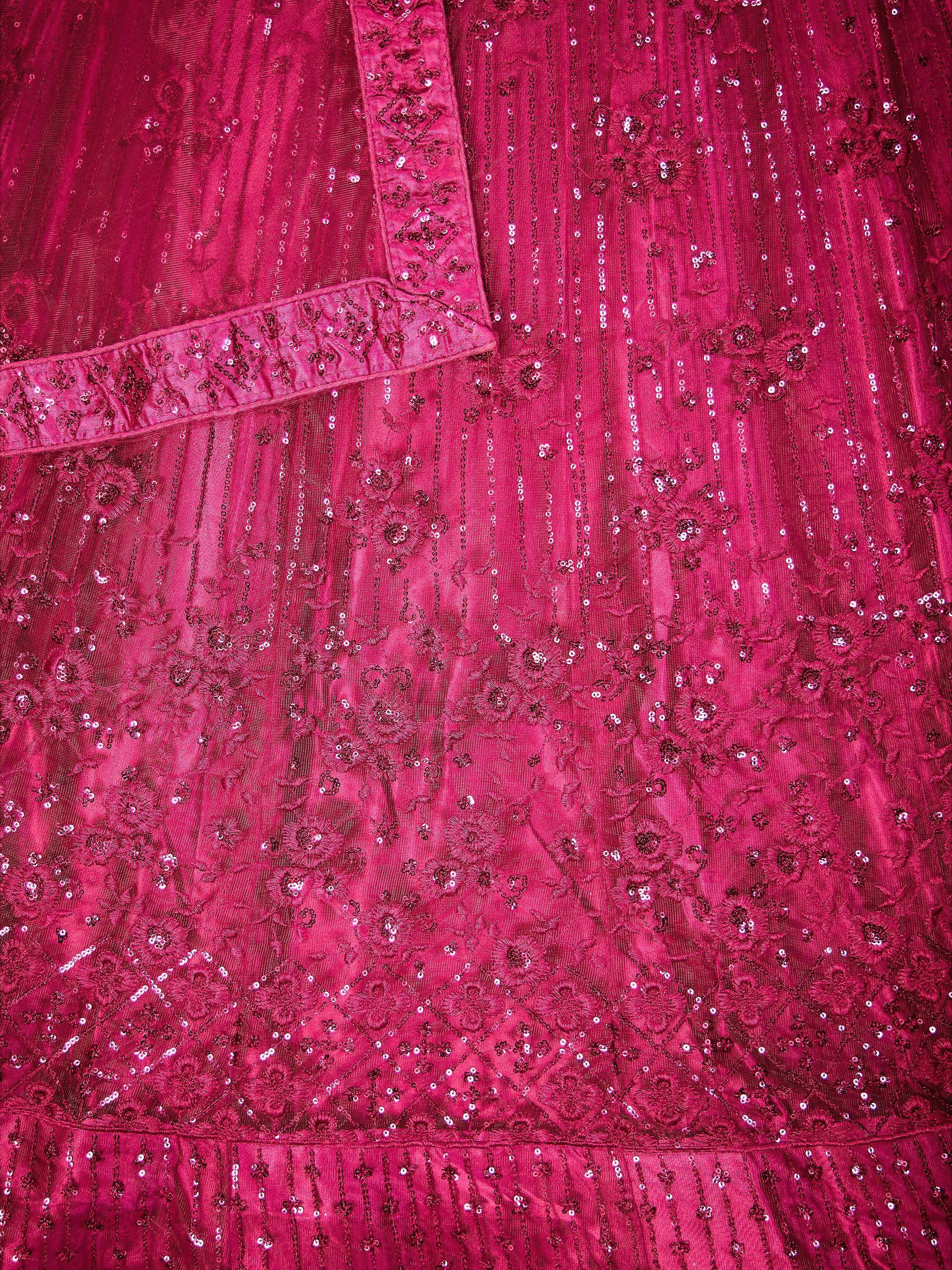 Fuchsia ethnic gown with intricate sequin embroidery and floral patterns, perfect for festive occasions.