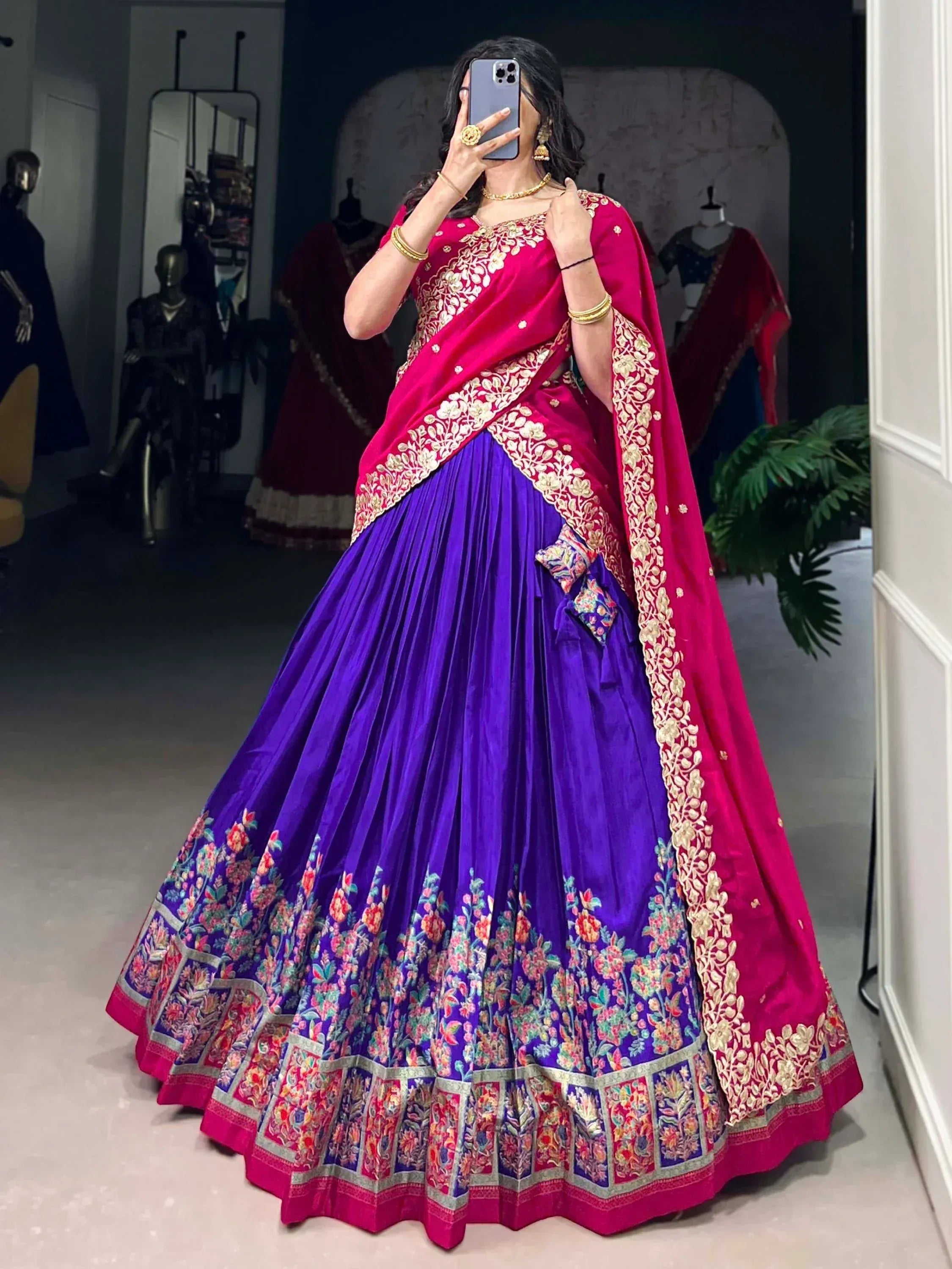 Purple and pink designer lehenga choli with gold embroidery, perfect for Indian weddings and festive occasions.