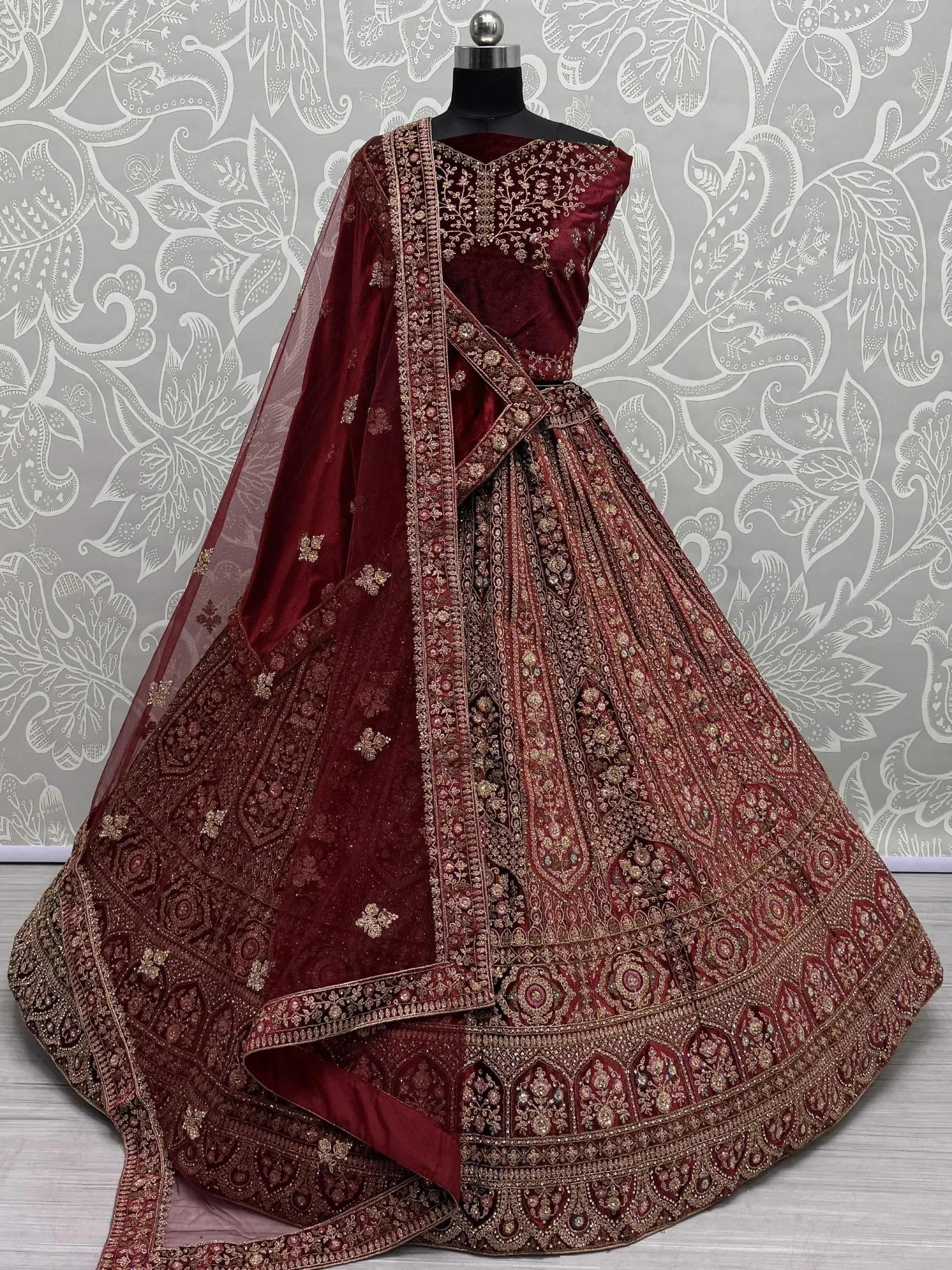 Maroon velvet designer lehenga choli with gold embroidery and net dupatta, ethnic Indian wear