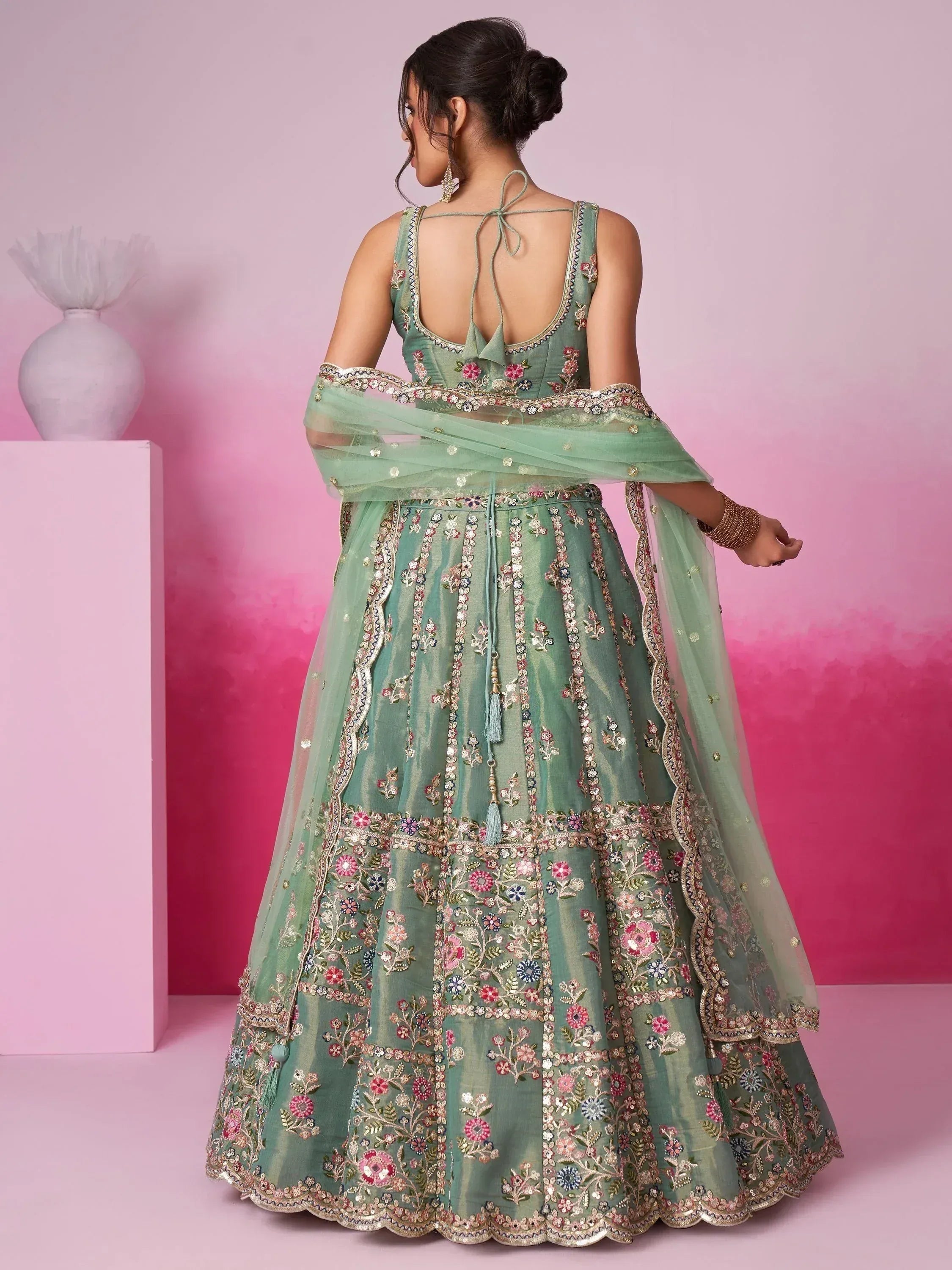 Mint green embroidered lehenga choli with floral motifs and back tie detail, perfect for Indian ethnic occasions