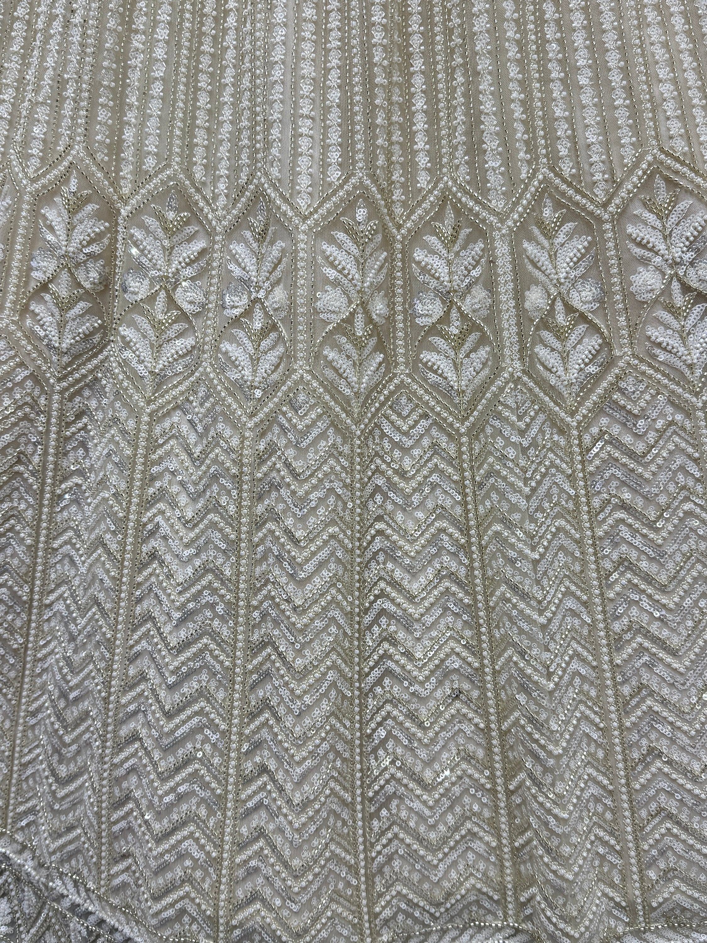 Elegant silver sequin and bead embroidery on sheer fabric for designer ethnic wear
