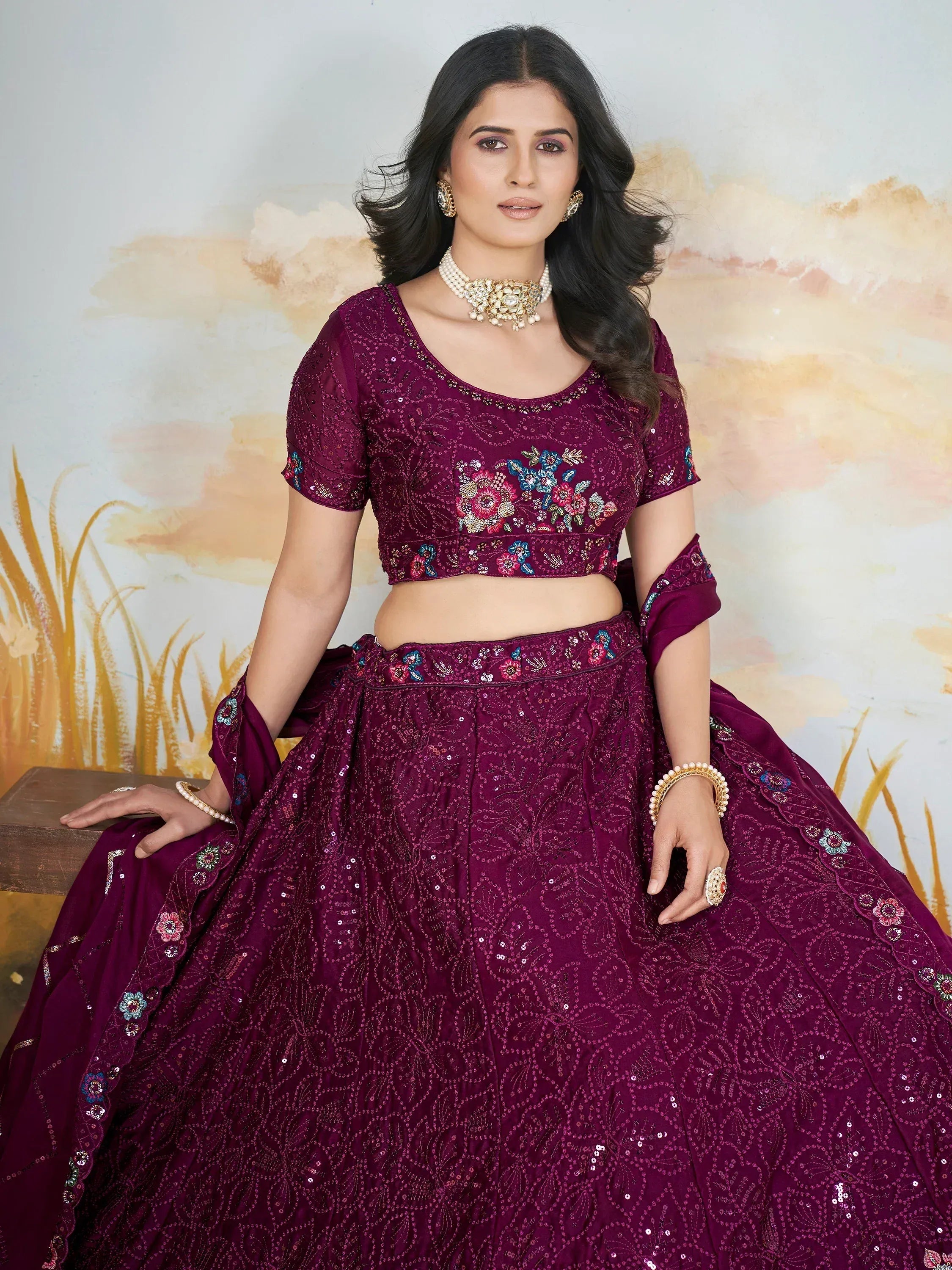 Elegant maroon lehenga choli with floral embroidery and sequins, perfect for Indian weddings and festive occasions.