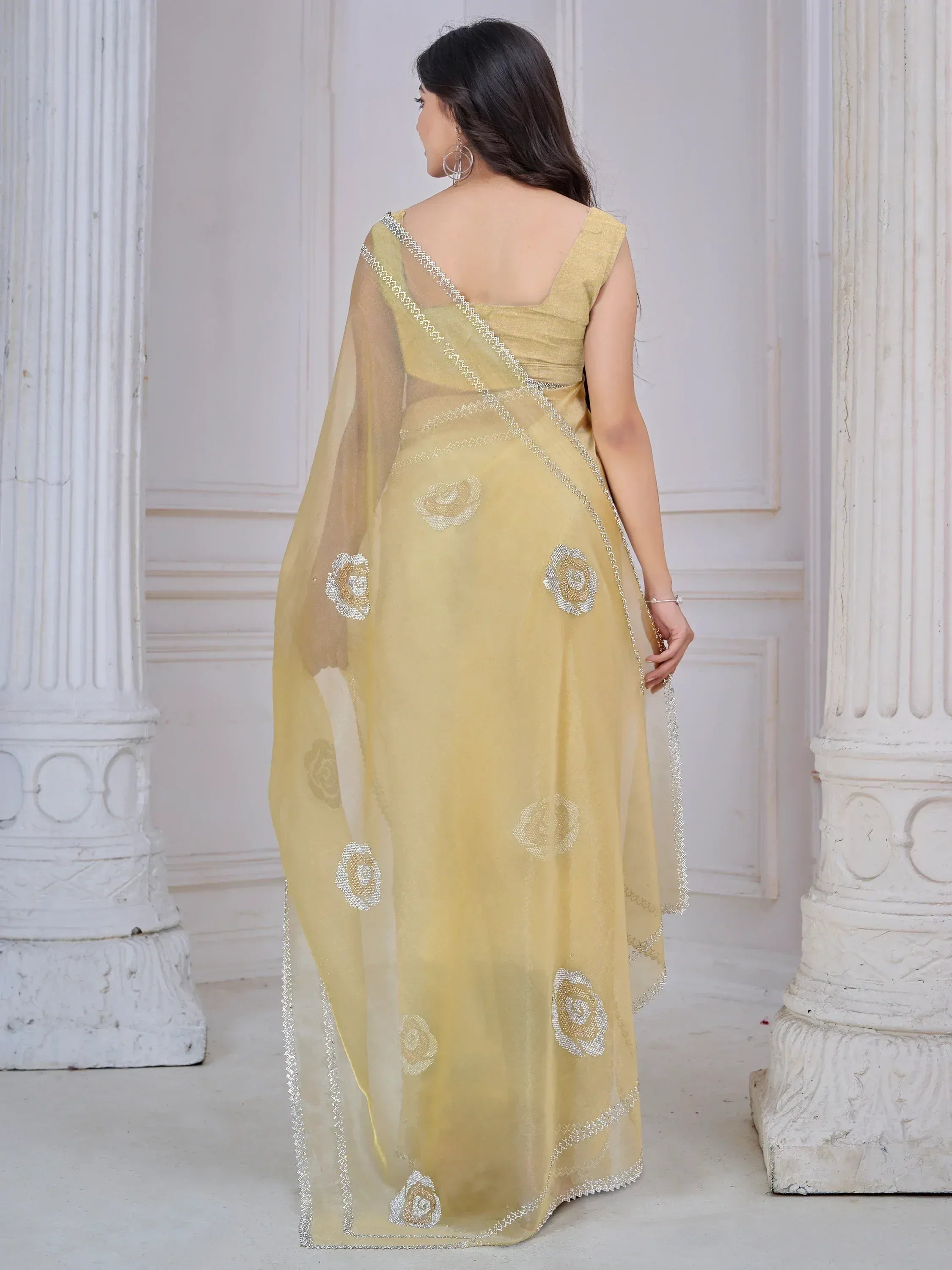 Yellow saree with floral embroidery and silver border, elegant ethnic wear for women