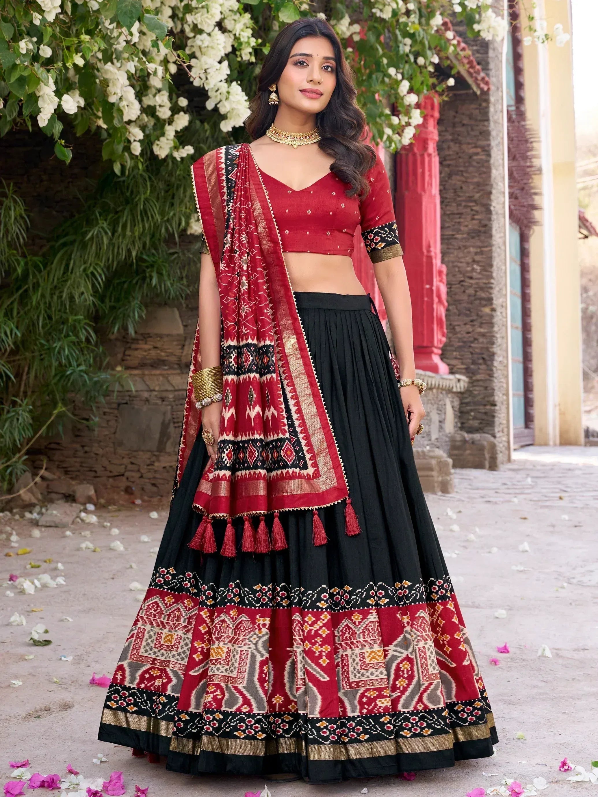 Red and black ethnic lehenga choli with printed dupatta, perfect for Indian weddings and festive occasions