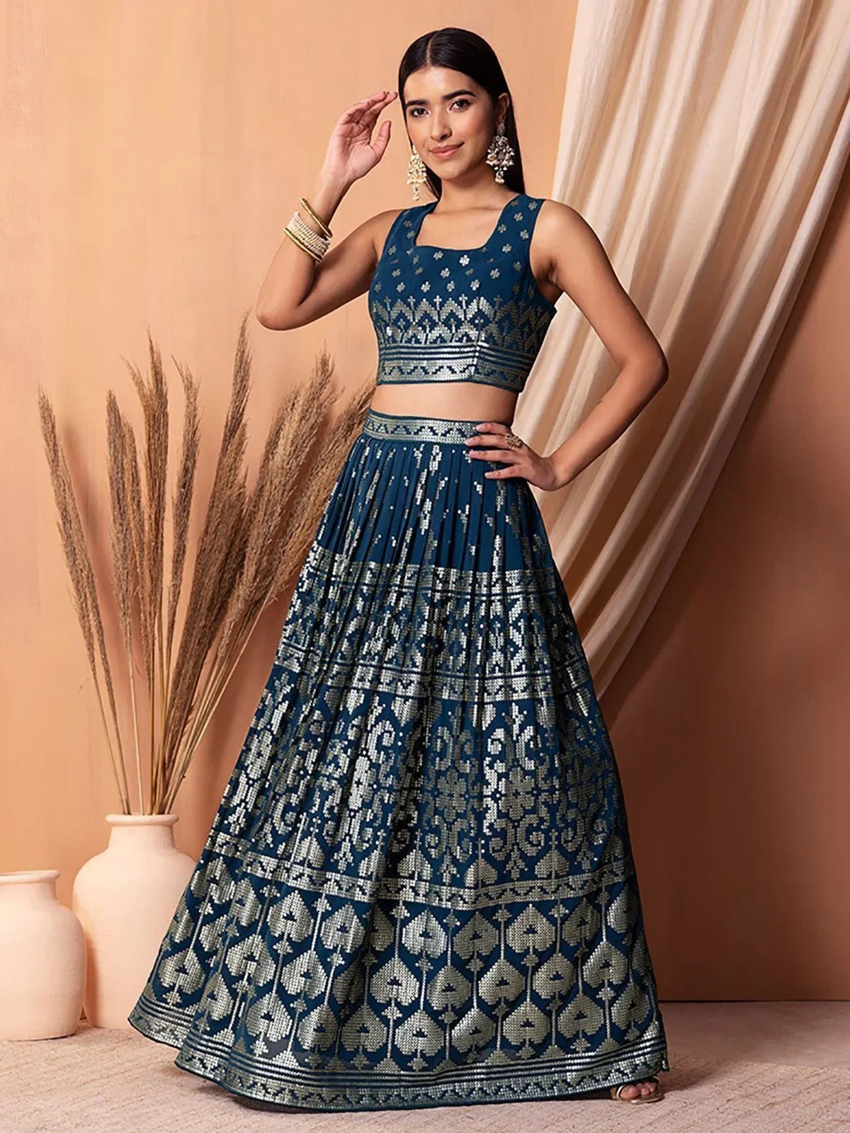 Blue embroidered lehenga choli with silver patterns, perfect for Indian ethnic wear events