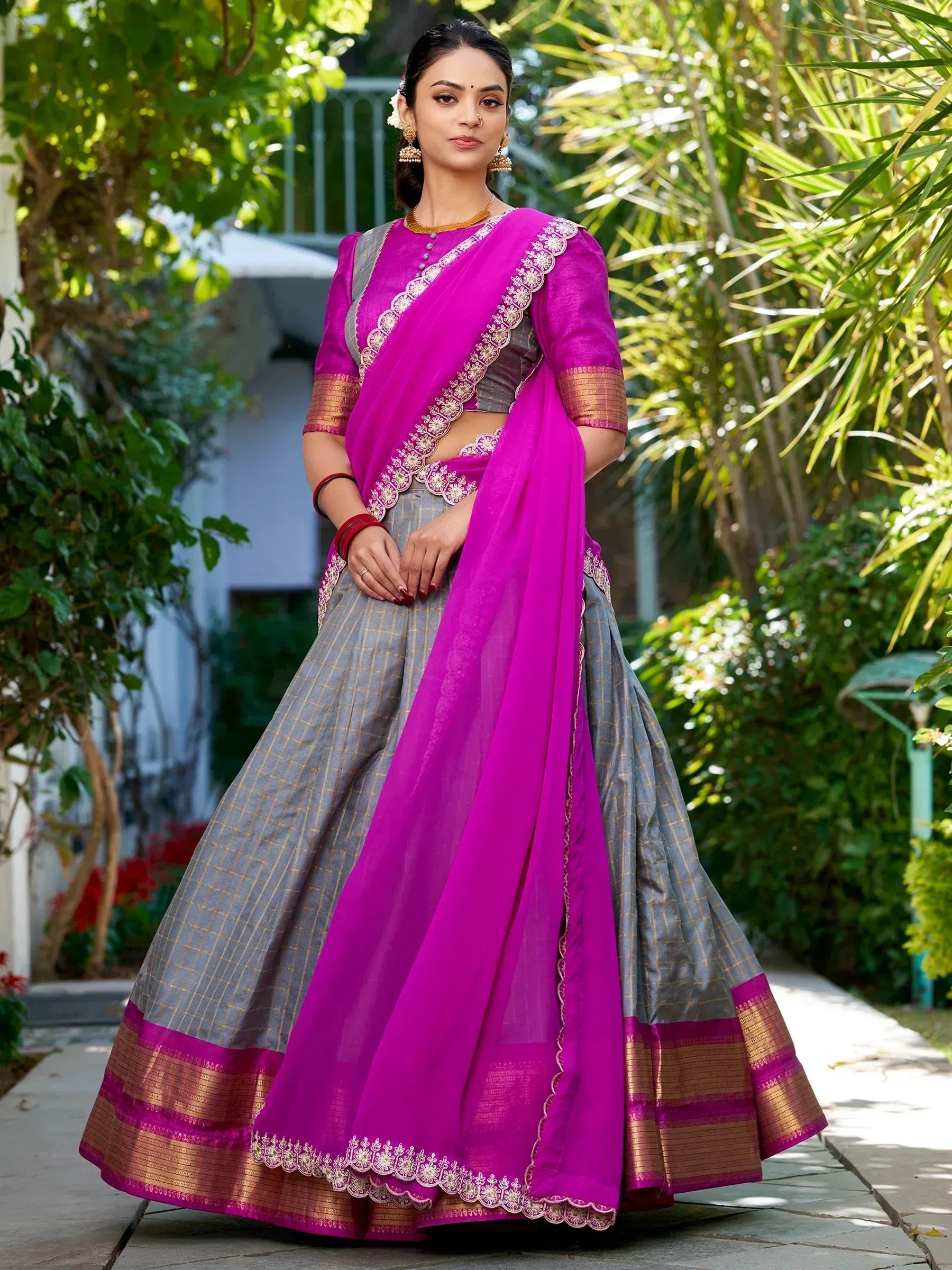 Vibrant pink and grey designer lehenga choli with gold embroidery, perfect for Indian ethnic occasions