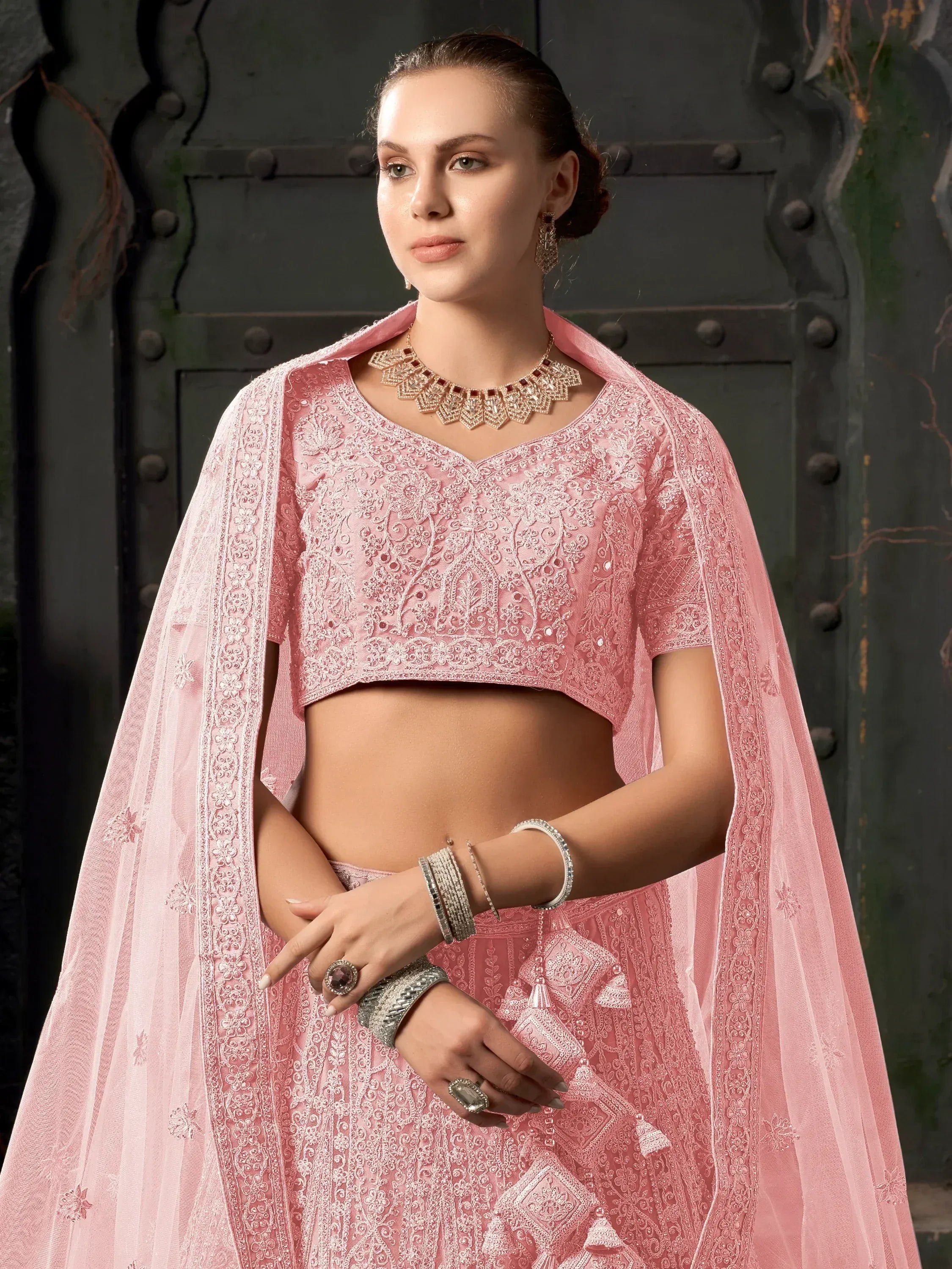Pink embroidered lehenga choli with sheer dupatta, perfect for Indian ethnic wear occasions