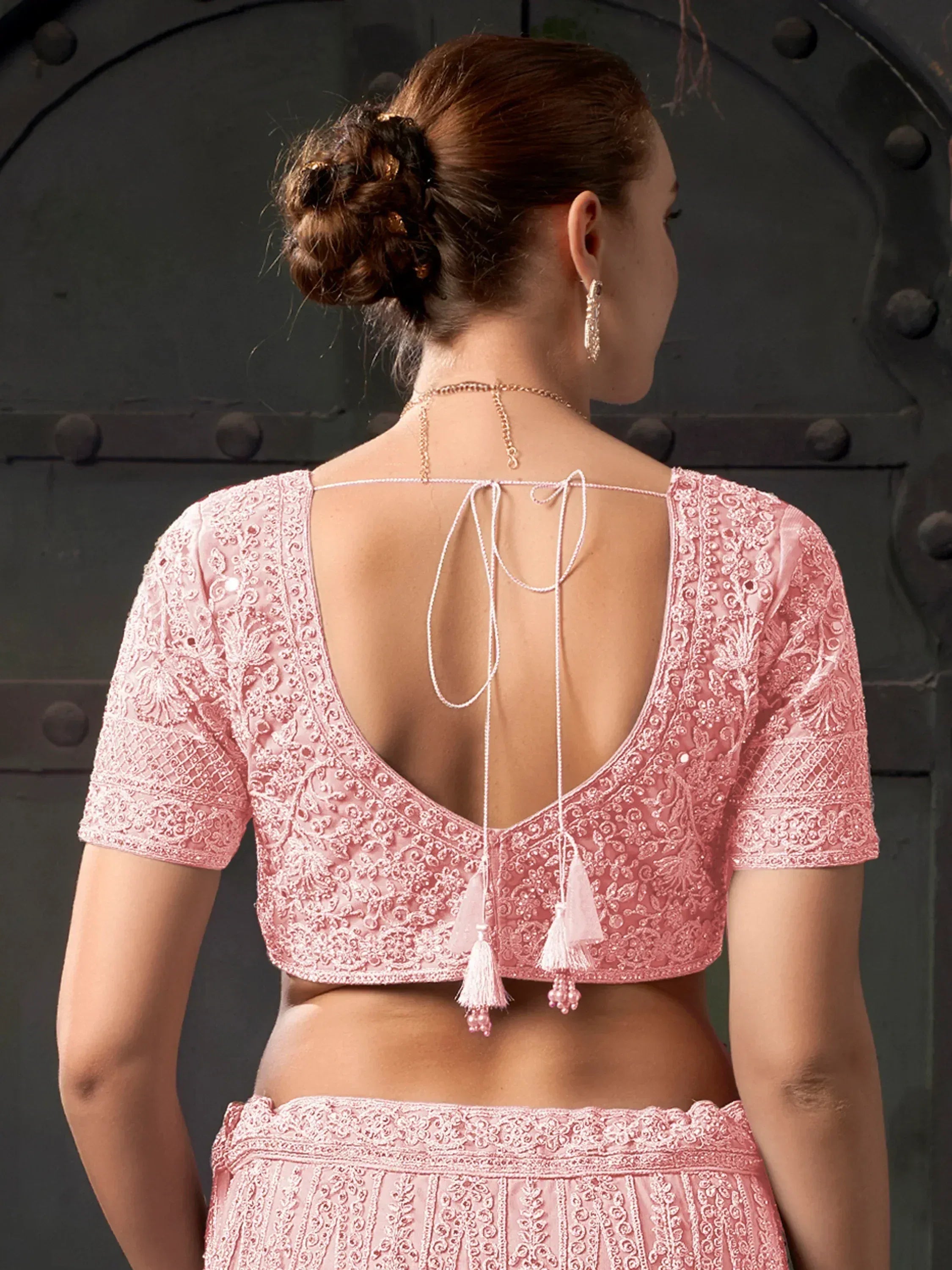Pink embroidered lehenga choli with open back and tassels, Indian ethnic wear