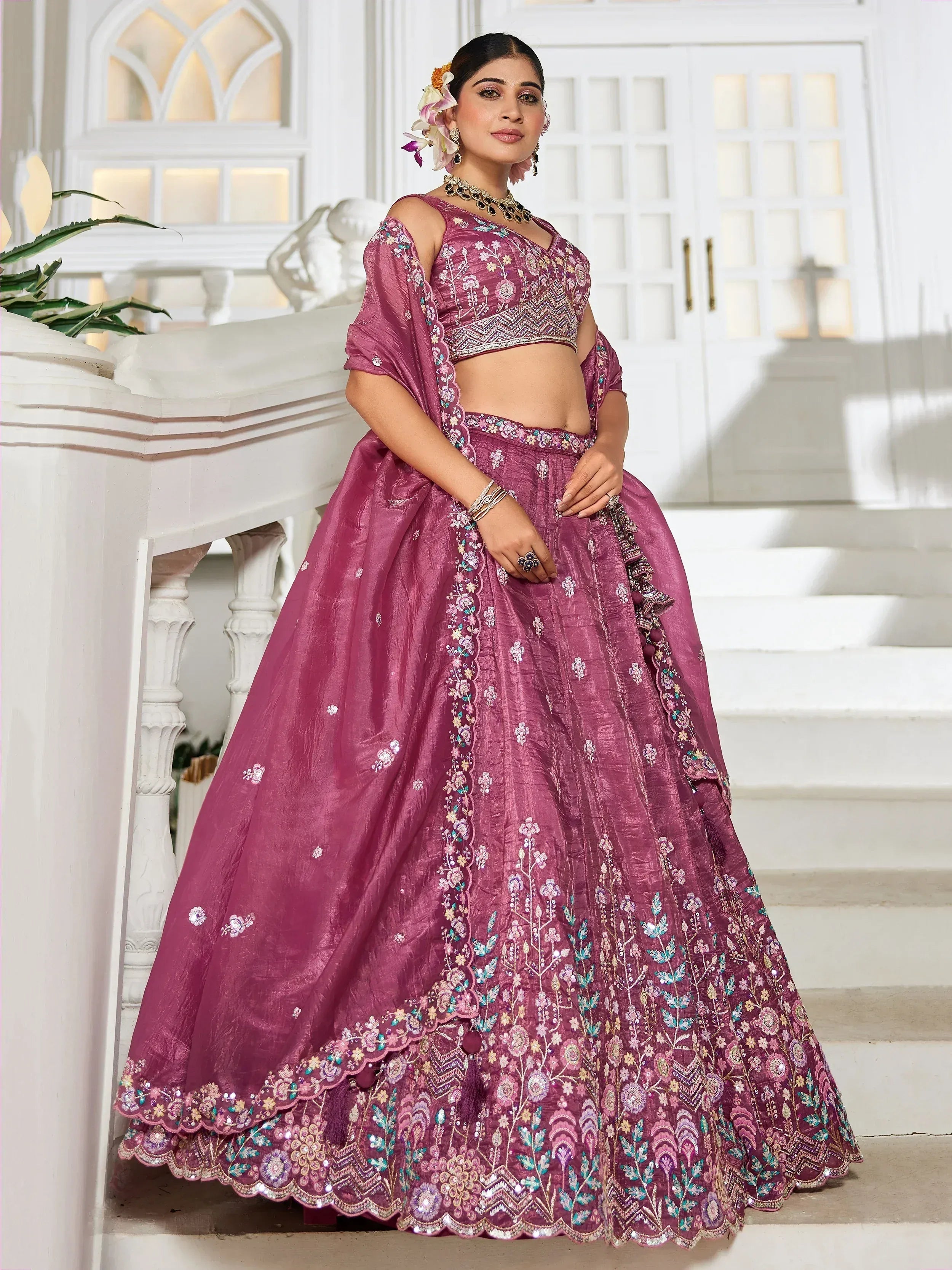 Purple embroidered lehenga choli with floral detailing, perfect for Indian weddings and festive occasions