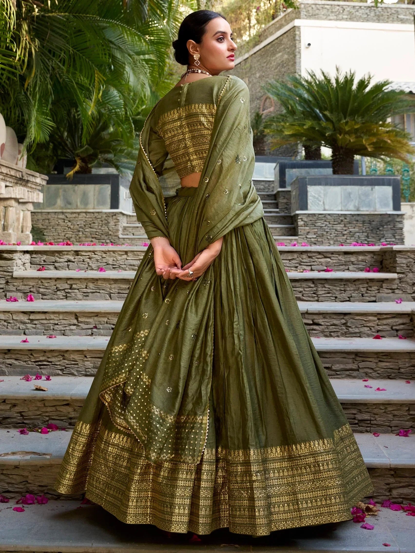 Olive green designer lehenga choli with gold embroidery, perfect for Indian ethnic wear occasions.