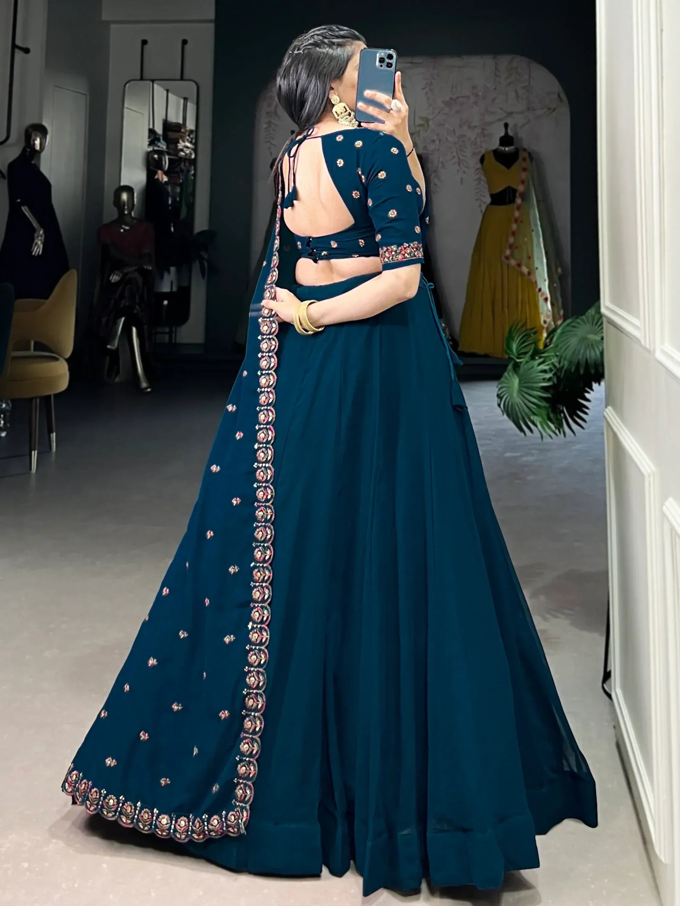 Teal designer lehenga choli with floral embroidery, backless blouse, perfect for Indian ethnic wear occasions