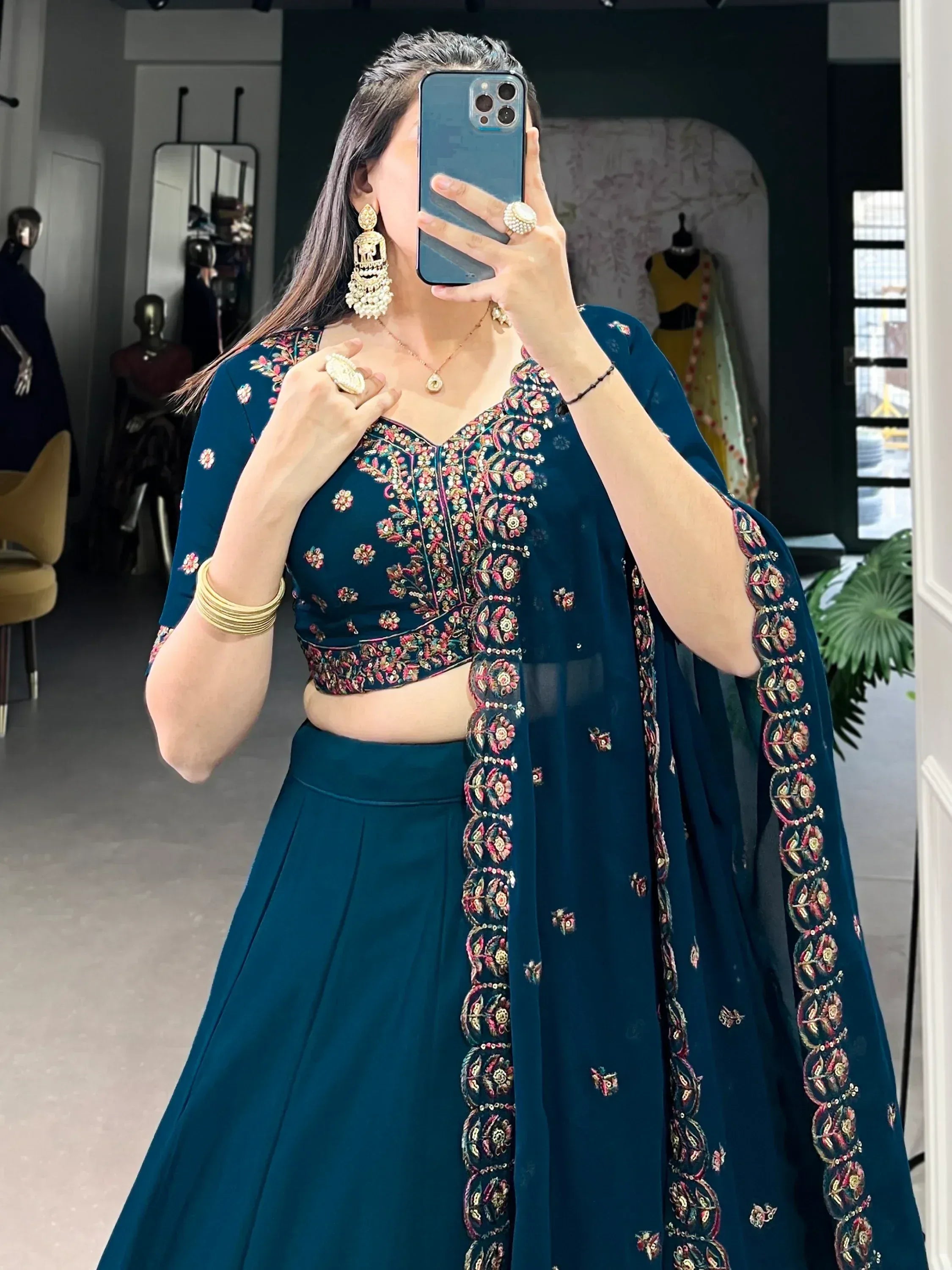 Teal embroidered lehenga choli with floral detailing, perfect for Indian ethnic wear occasions