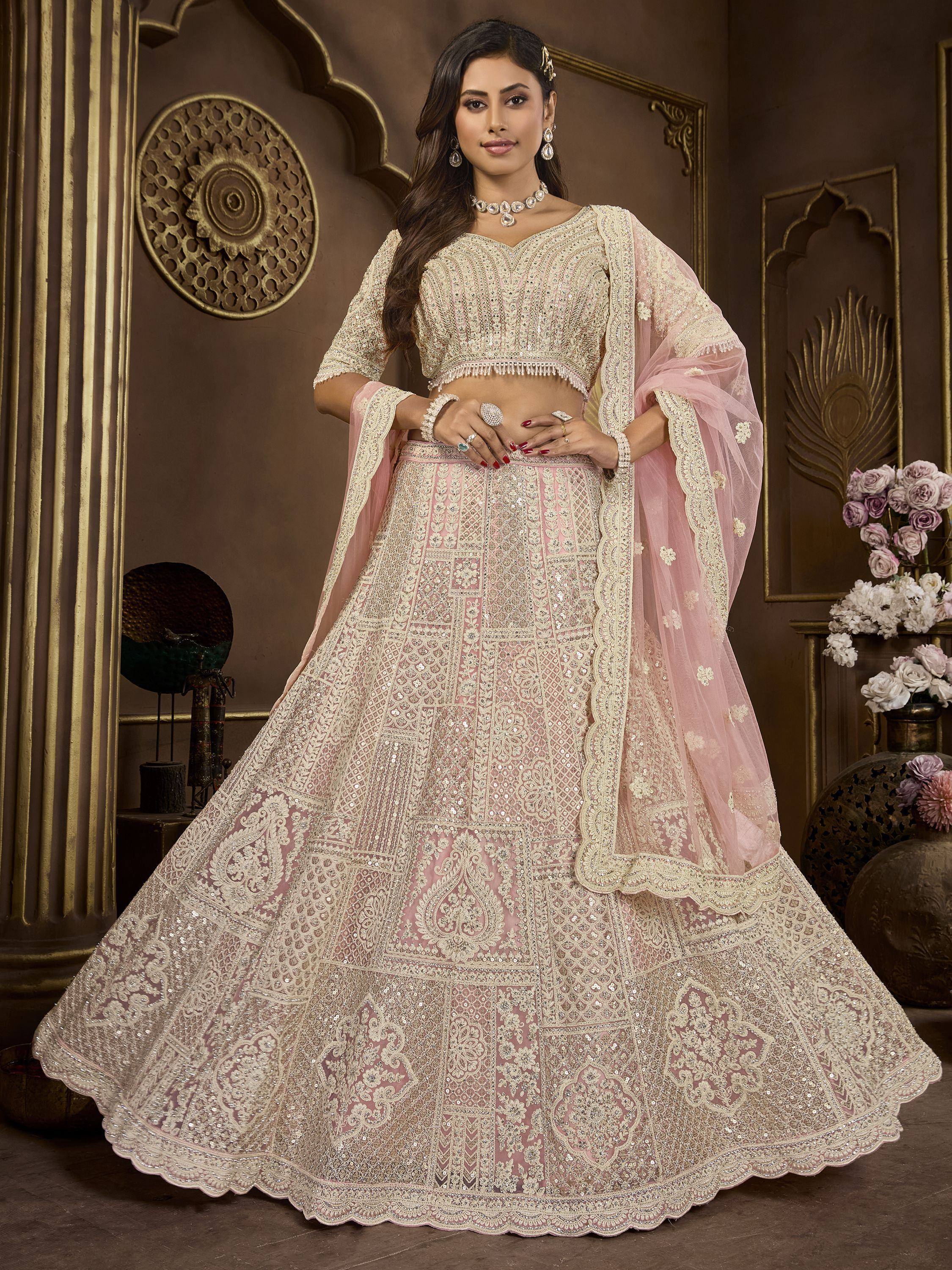 Elegant pink and cream embroidered lehenga choli with net dupatta, perfect for weddings and festive occasions.