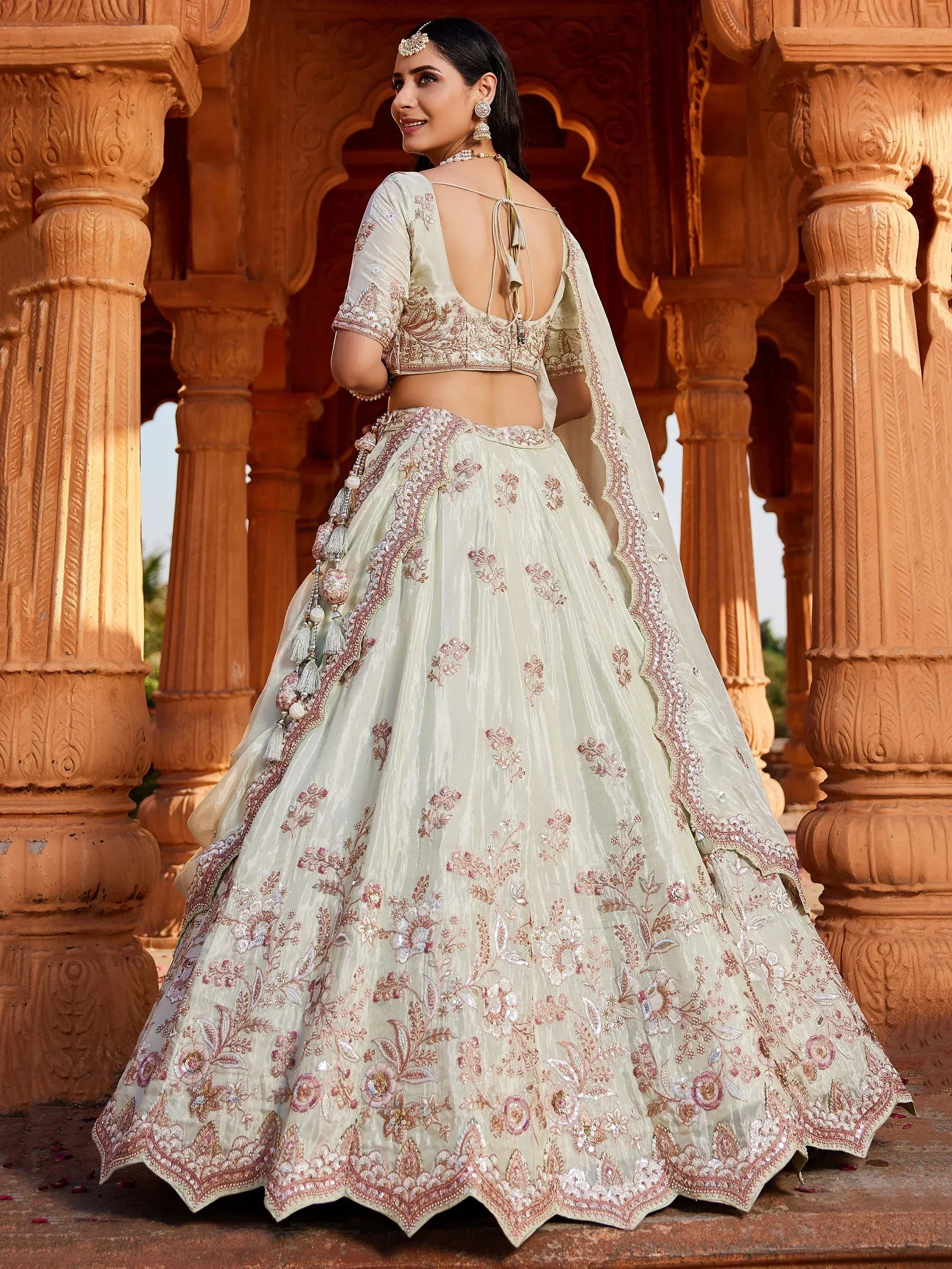 Elegant pastel lehenga choli with floral embroidery, perfect for Indian weddings and festive occasions.