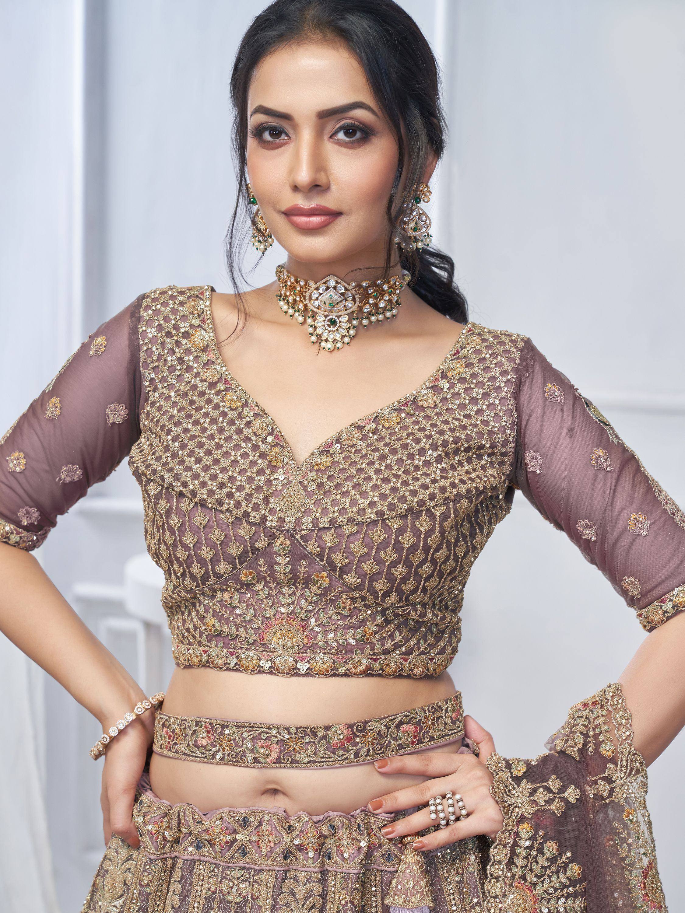 Elegant mauve lehenga choli with gold floral embroidery, perfect for Indian weddings and festive occasions.