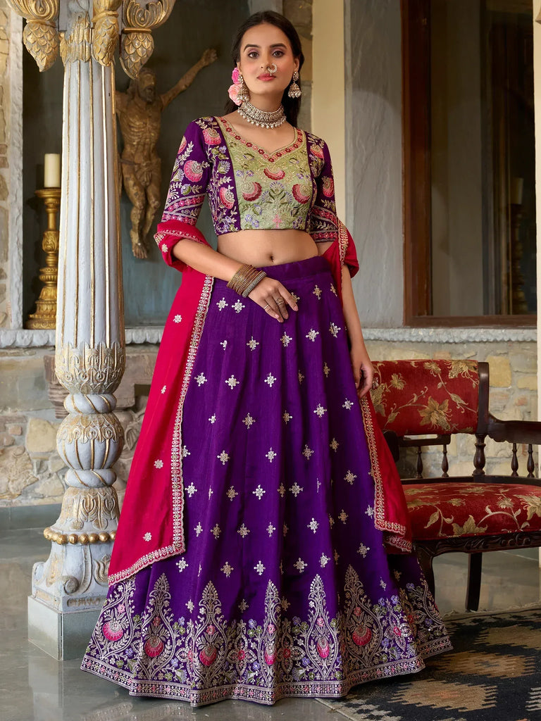 Purple and green embroidered lehenga choli with floral motifs, perfect for Indian ethnic wear occasions.