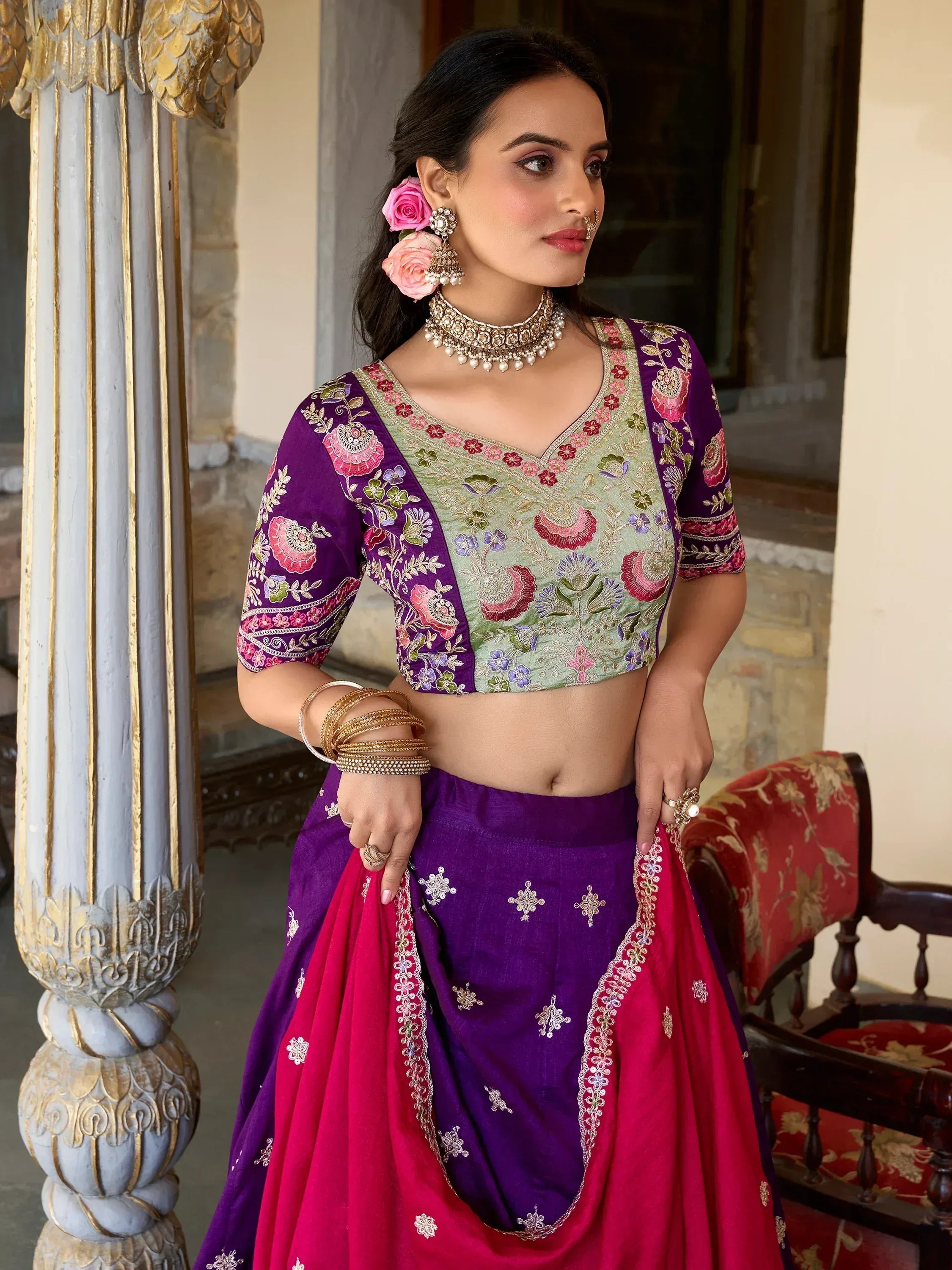Purple and pink embroidered lehenga choli with floral blouse, perfect for Indian weddings and festive occasions.
