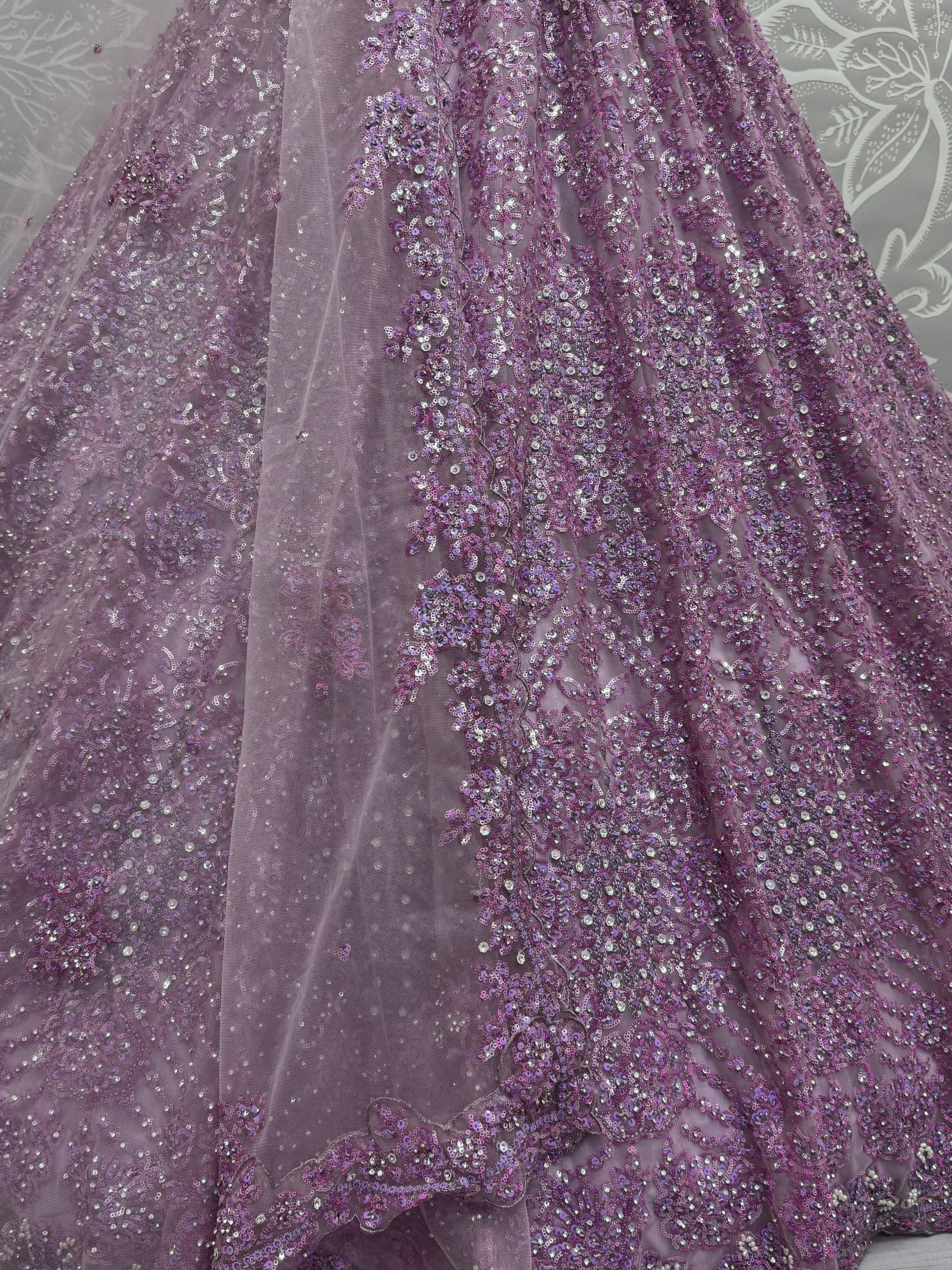 Purple sequin-embellished ethnic gown with floral embroidery, perfect for Indian weddings and festive occasions.