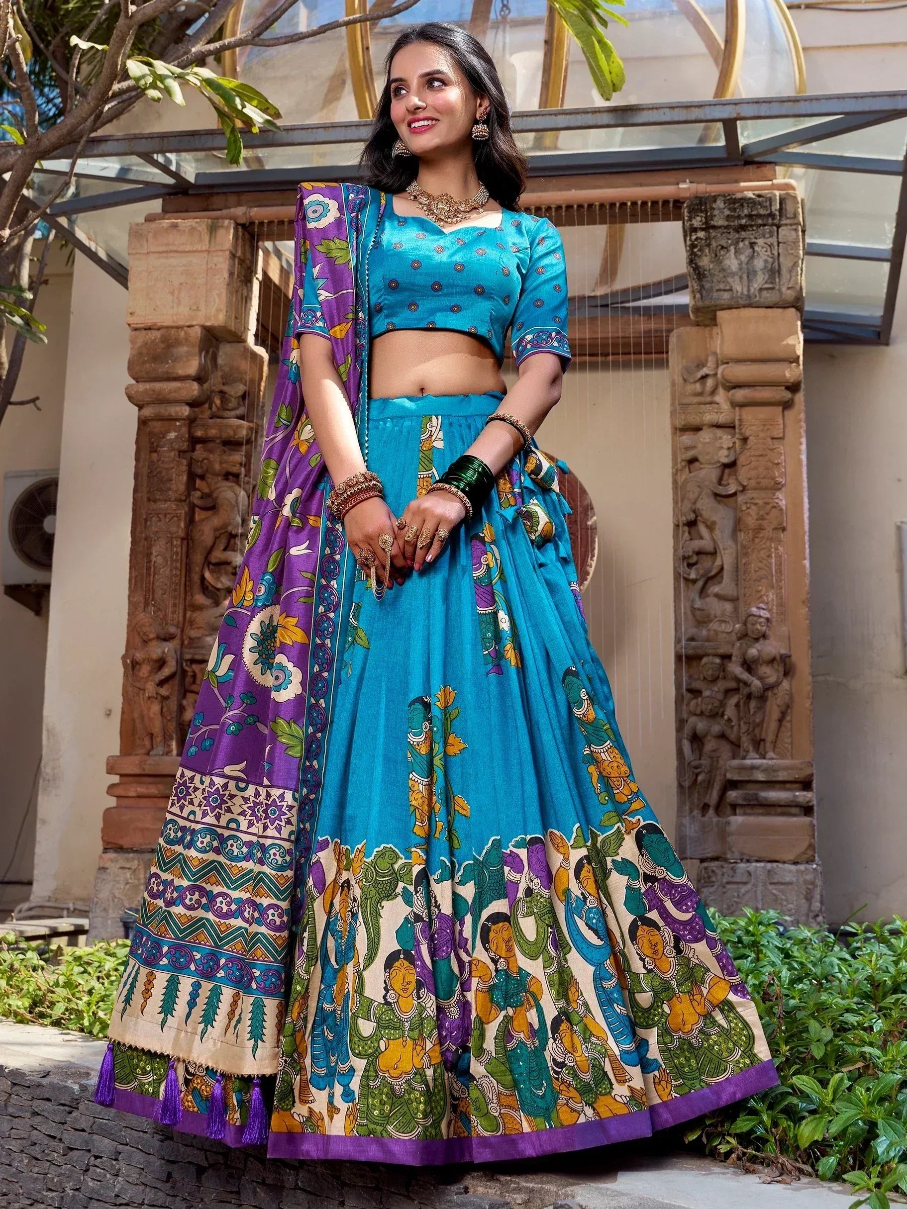 Blue and purple printed lehenga choli with ethnic artwork, perfect for Indian festive occasions