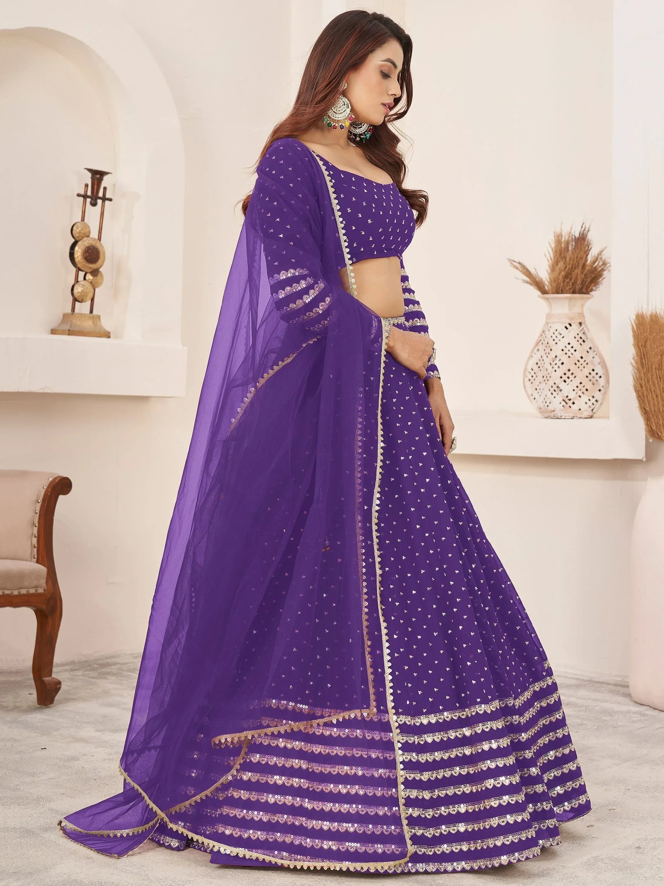 Purple designer lehenga choli with gold embroidery and sheer dupatta for Indian ethnic wear